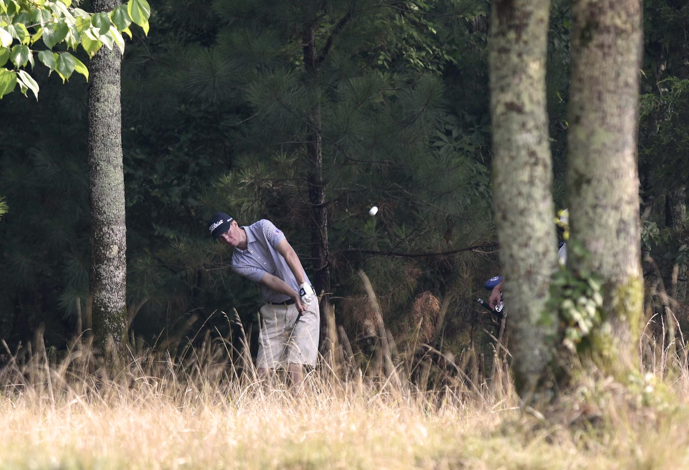 Brandon Gillis of Nashua, New Hampshire chips out of the wood along the 4th fairway.  Gillis lost to Min Woo Lee of Australia 4 and 2.  The fifth day of the 69th U.S. Junior Amateur Championship was held at the Honors Course in Ooltewah, Tennessee, Friday July 22, 2016.