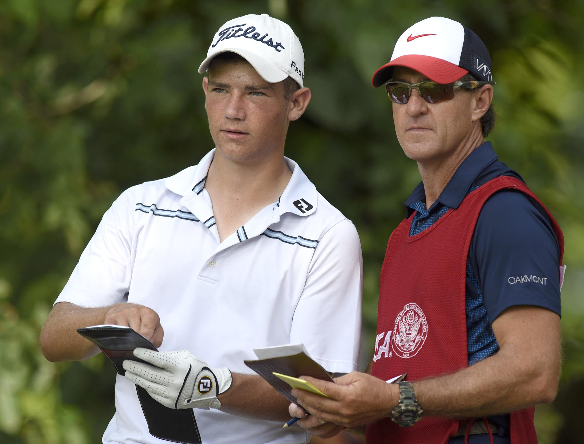 Noah Goodwin of Corinth, Texas and his caddie study the 12th fairway from the tee.  Goodwin defeated Fred Lee of Australia in their quarterfinal match 5 and 4.  The fifth day of the 69th U.S. Junior Amateur Championship was held at the Honors Course in Ooltewah, Tennessee, Friday July 22, 2016.