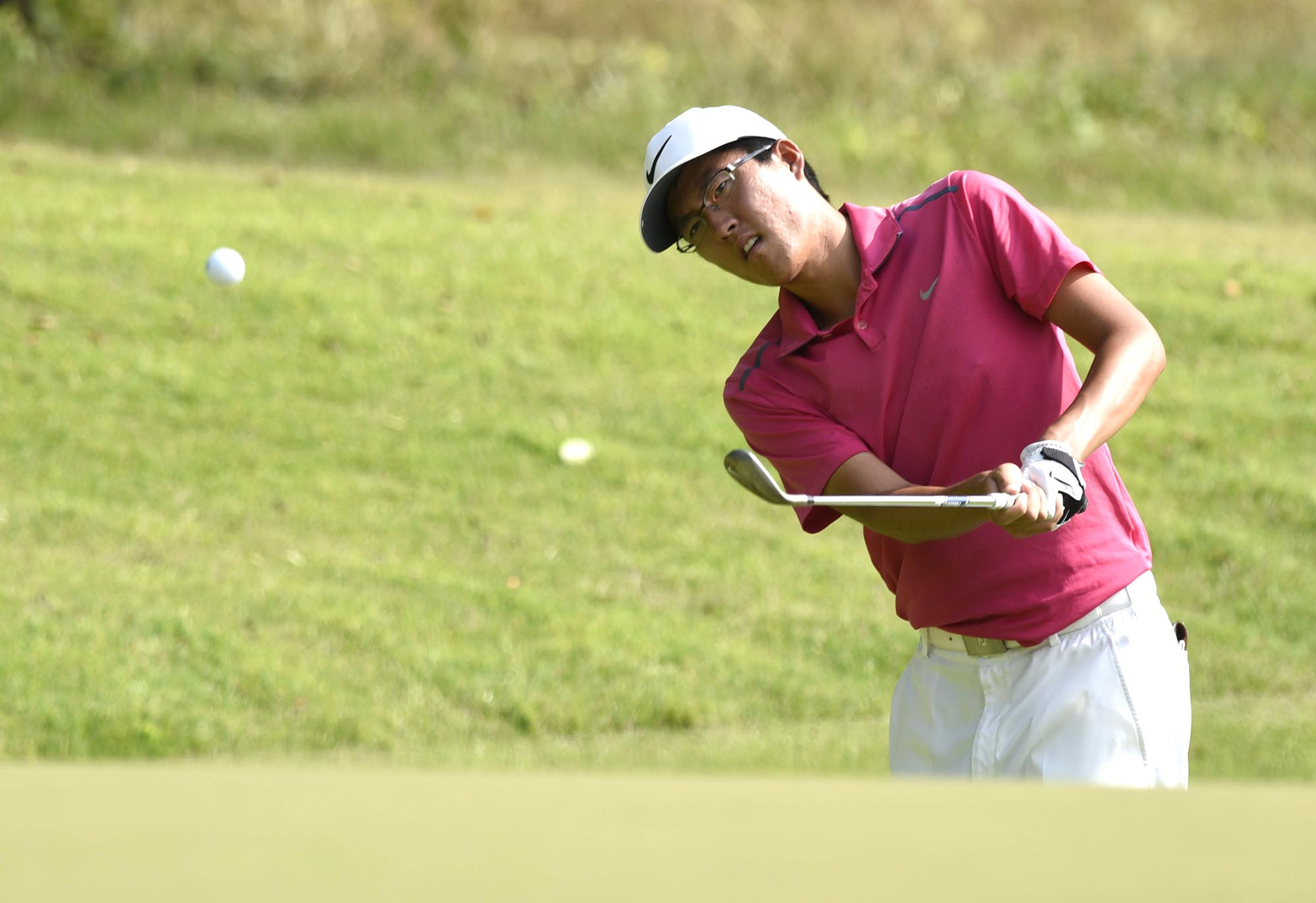 Won Jun Lee of the Republic of Korea chips onto the 11th green.  Lee lost his quarterfinal match to John Pak of Scotch Plains, New Jersey 1 up.  The fifth day of the 69th U.S. Junior Amateur Championship was held at the Honors Course in Ooltewah, Tennessee, Friday July 22, 2016.