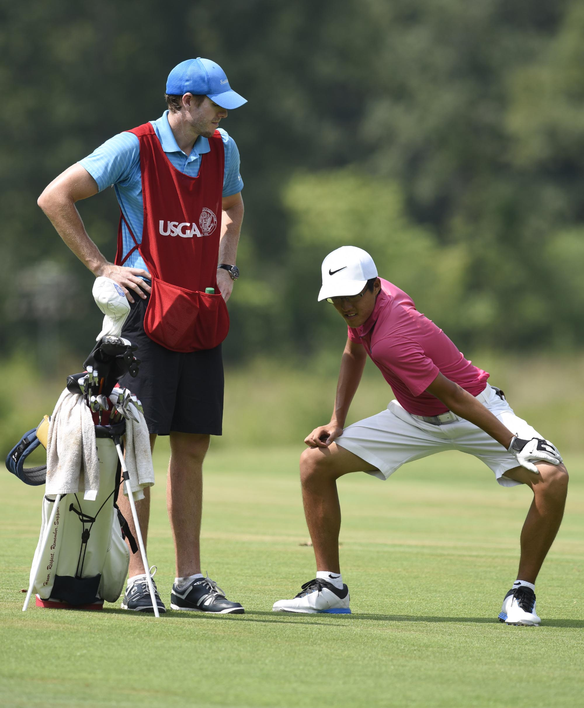 Won Jun Lee of the Republic of Korea loosens up on the 15th fairway.  Lee lost his quarterfinal match to John Pak of Scotch Plains, New Jersey 1 up.  The fifth day of the 69th U.S. Junior Amateur Championship was held at the Honors Course in Ooltewah, Tennessee, Friday July 22, 2016.