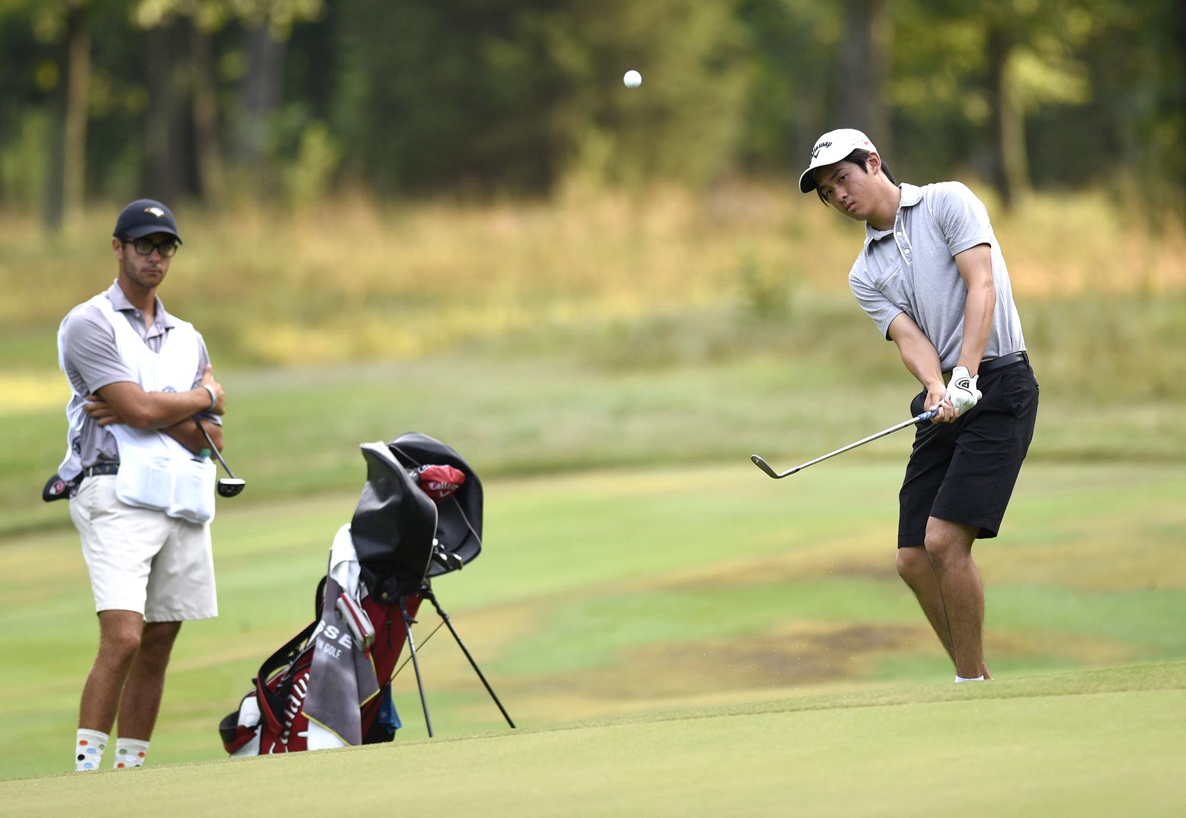 Australia's Fred Lee chips to the 3rd green in his quarterfinal match with Noah Goodwin of Corinth Texas.  Lee lost to Goodwin 5 and 4.  The fifth day of the 69th U.S. Junior Amateur Championship was held at the Honors Course in Ooltewah, Tennessee, Friday July 22, 2016.