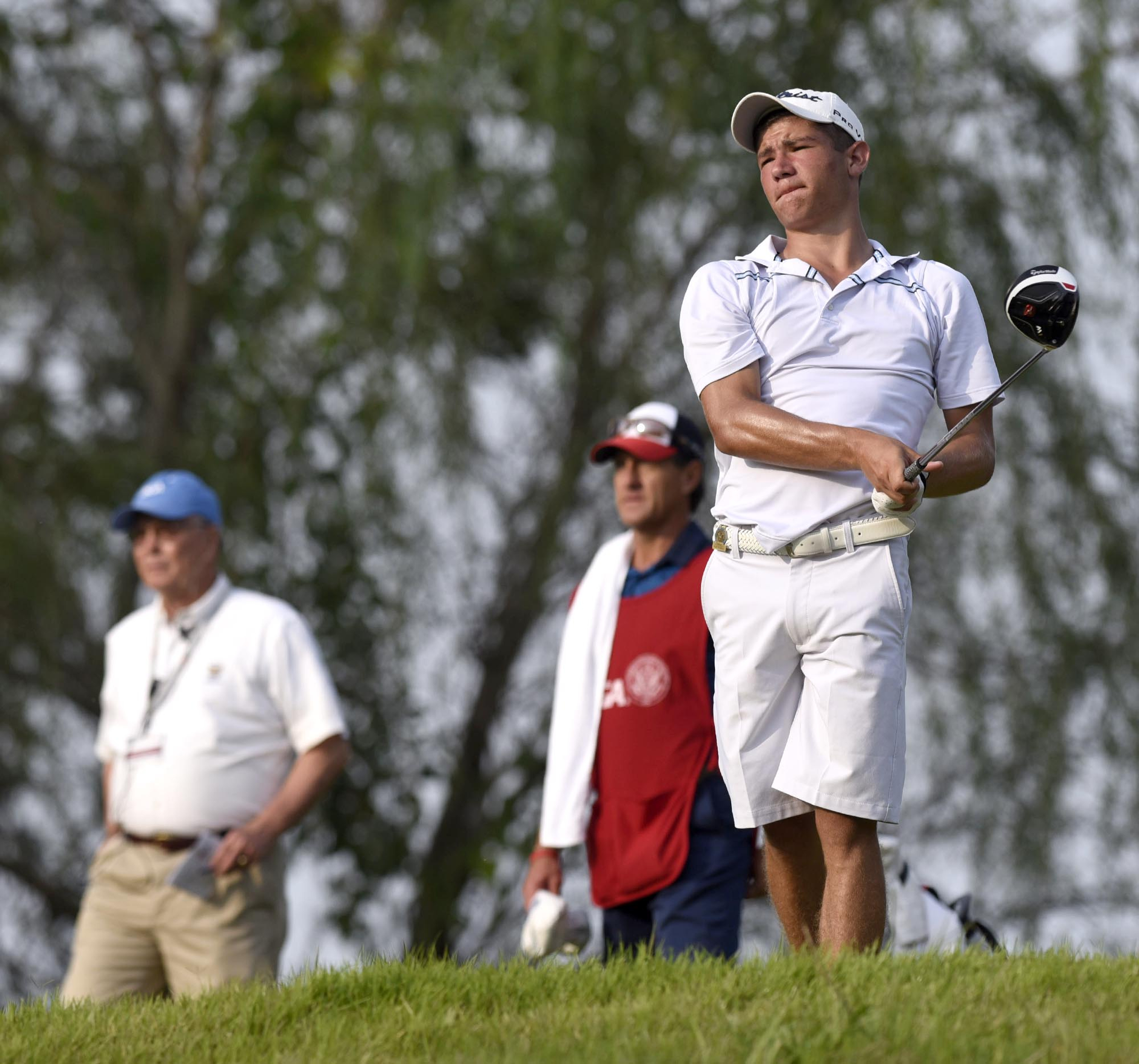 Noah Goodwin of Corinth, Texas watches his drive on the 5th hole.  Goodwin won his quarterfinal match against Fred Lee of Australia 5 and 4.  The fifth day of the 69th U.S. Junior Amateur Championship was held at the Honors Course in Ooltewah, Tennessee, Friday July 22, 2016.