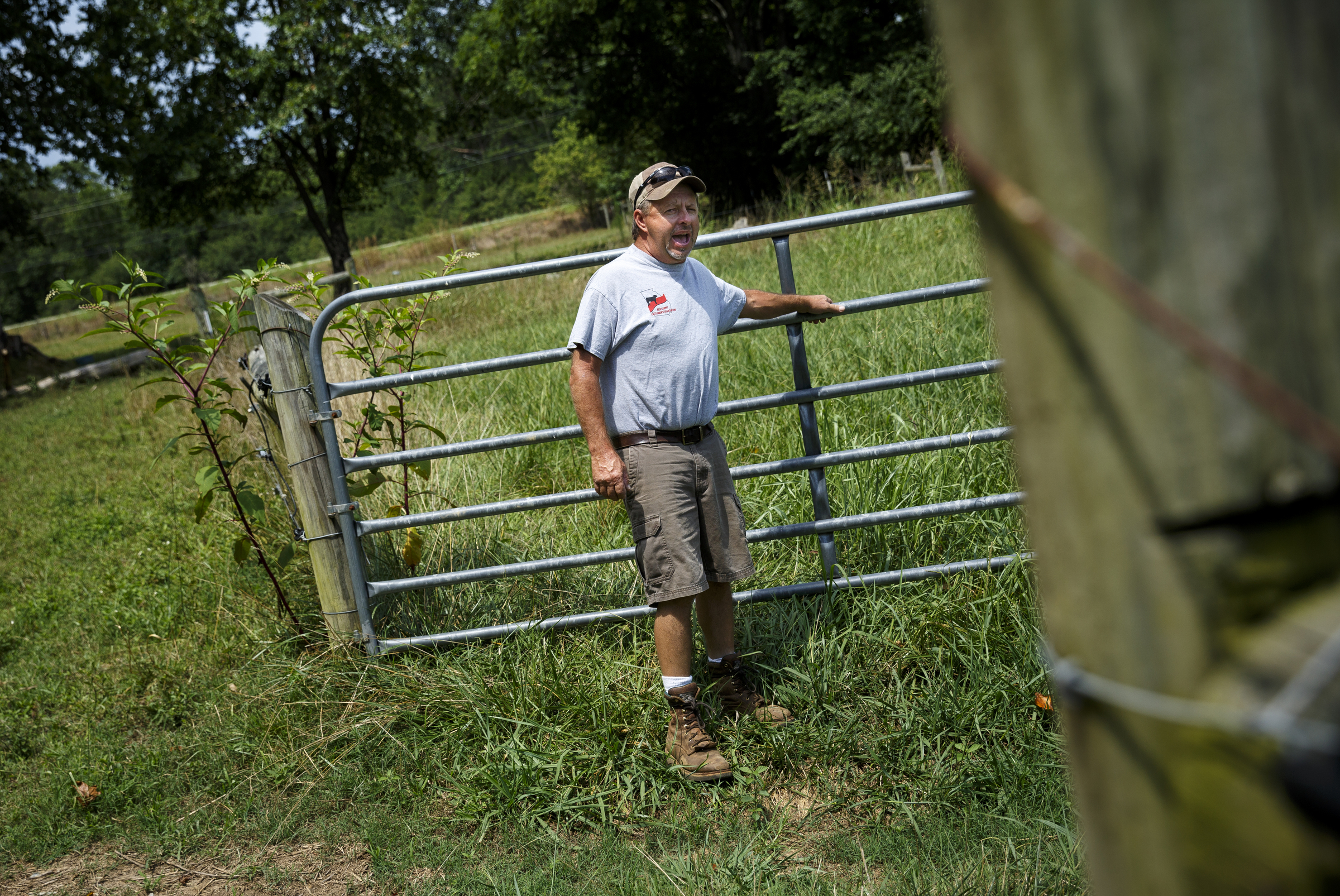 James Burton opens a gate to move cattle into one of his hay fields, which he would normally allow to grow this time of year, at at his farm on Thursday, July 21, 2016, in LaFayette, Ga. Burton says that the ongoing drought has forced him to graze cattle in fields he would normally save for next year, and while he would normally be selling his hay to customers, he has only just enough to last his own farm through the winter.