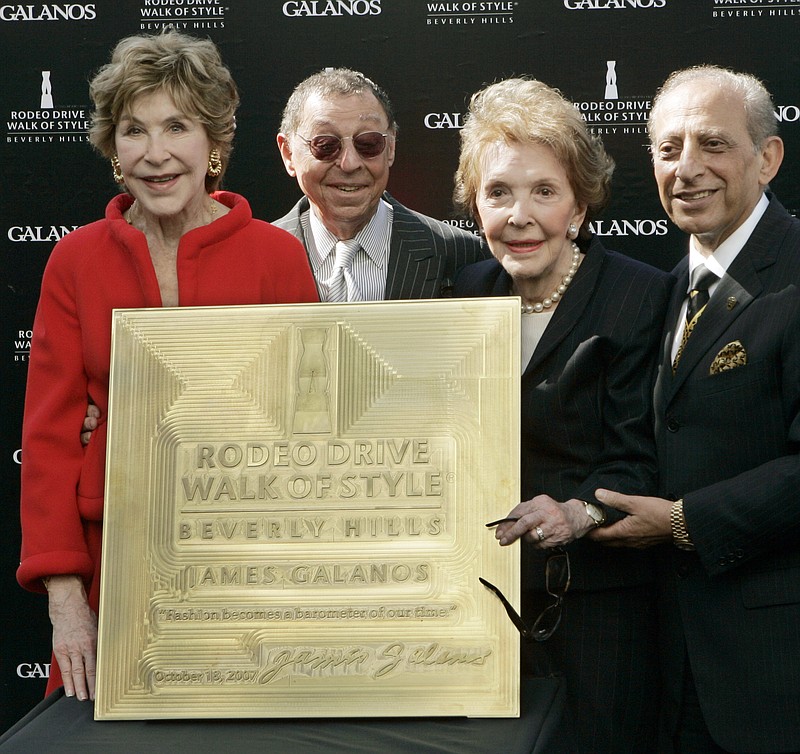 
              FILE - In this Oct. 18, 2007 file photo, celebrated fashion designer James Galanos, second from left, is joined by Betsy Bloomingdale, left, former first lady Nancy Reagan and Mayor Jimmy Delshad, as Galanos is honored with the Rodeo Drive Walk of Style Award in Beverly Hills, Calif. Betsy Bloomingdale, the widow of a department store heir who hobnobbed with the world’s elite and was best friends with Nancy Reagan, has died. She was 93. Her daughter-in-law says Bloomingdale died Tuesday, July 19, 2016, at her Los Angeles home from congestive heart failure. (AP Photo/Reed Saxon, File)
            
