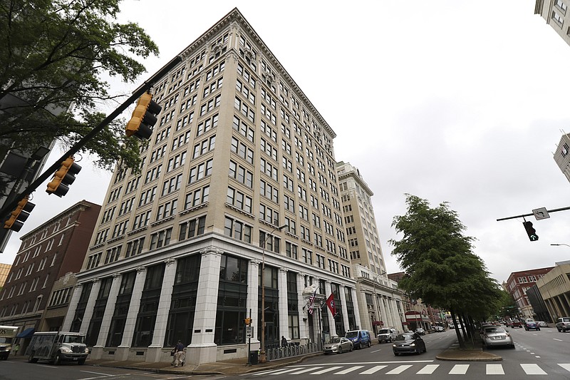 Cars drive past the James Building in downtown Chattanooga on Wednesday, April 15, 2015.