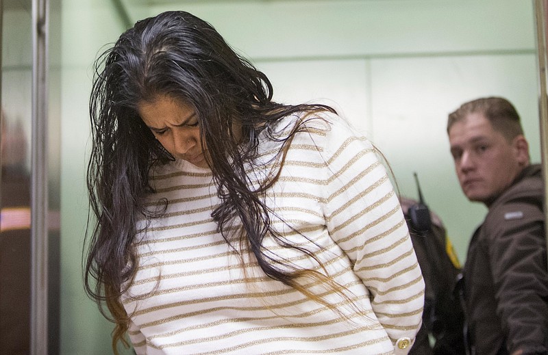 
              FILE - In this March 30, 2015 file photo, Purvi Patel is taken into custody at the St. Joseph County Courthouse in South Bend, Ind., after being sentenced to 20 years in prison for feticide and neglect of a dependent. On Friday, July 22, 2016, the Indiana Court of Appeals overturned the conviction of Patel, who was found guilty of killing the premature infant she delivered after ingesting abortion-inducing drugs. However, the court upheld a lower-level felony neglect of a dependent conviction. (Robert Franklin/South Bend Tribune via AP, File)
            