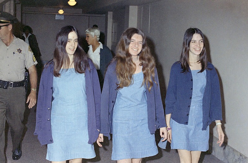 
              FILE - In this Aug. 20, 1970 file photo, Charles Manson followers, from left: Susan Atkins, Patricia Krenwinkel and Leslie Van Houten, walk to court to appear for their roles in the 1969 cult killings of seven people, including pregnant actress Sharon Tate, in Los Angeles, Calif. California Gov. Jerry Brown is denying parole for Van Houten, the youngest follower of murderous cult leader Charles Manson. The Democratic governor said Friday, July 22, 2016, Van Houten’s “inability to explain her willing participation in such horrific violence” leads him to believe she remains an unreasonable risk to society. (AP Photo/George Brich, File)
            