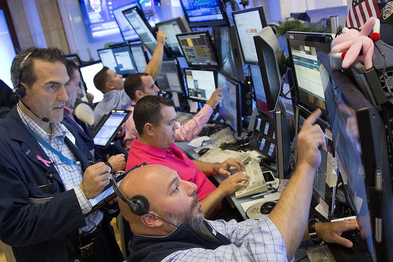 
              Greg Rowe, left, and Vincent Napolitano, bottom, with Livermore Trading Group, monitor stock prices at the New York Stock Exchange, Friday, July 22, 2016. (AP Photo/Mark Lennihan)
            