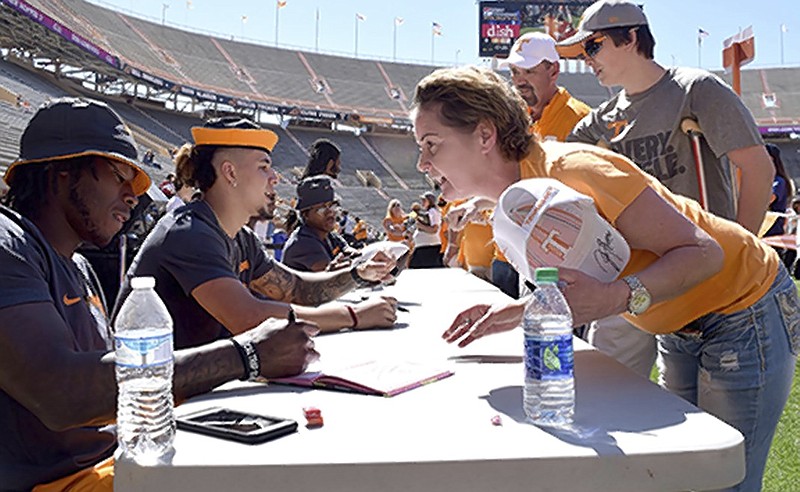 From left, Tennessee running backs Alvin Kamara and Jalen Hurd sign autographs for fans at the UT Fan Day during the Orange/White Spring Football Game at Neyland Stadium in Knoxville on April 16. The two will headline the Volunteers' running game this season.