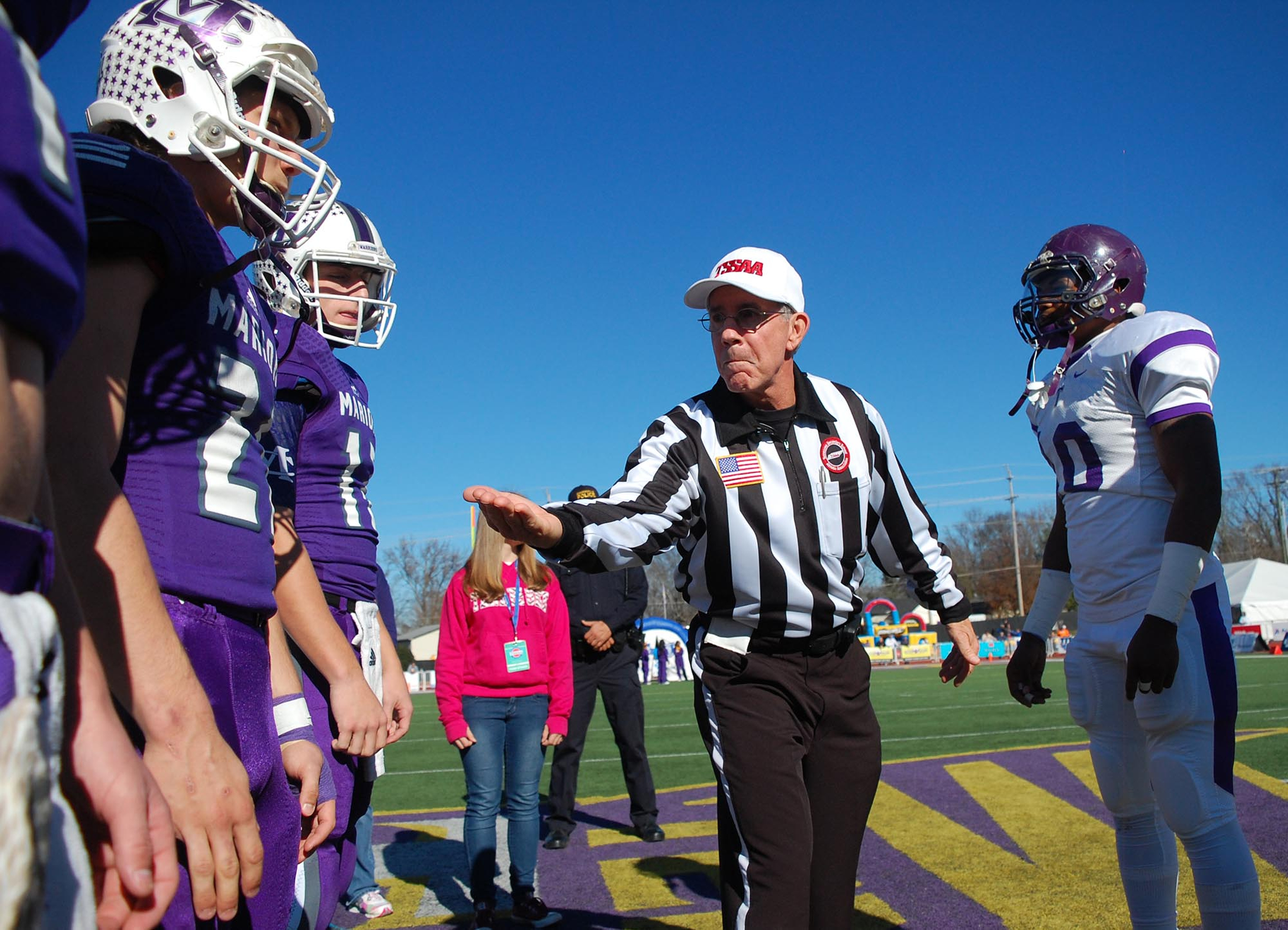 The referee shows the coin to the captains before the toss.  The Marion County Warriors faced the Trezevant Bears in the Division I Class 2A Tennessee State Football Championships in the BlueCross Bowl at Tennessee Tech's Tucker Stadium on Saturday, December 5, 2015.