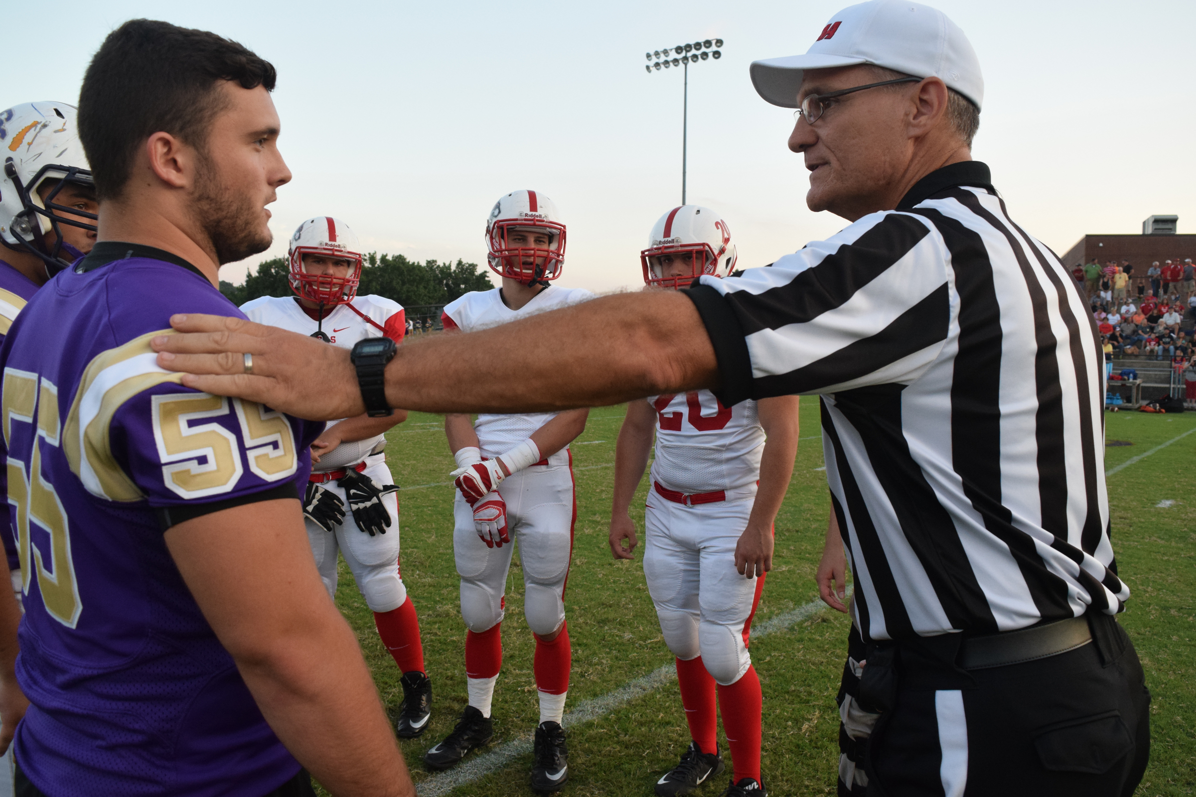 The referee tells injured captain Billy Morrisonn (55) that the Indians has won the toss.  The Whitwell Tigers visited the Sequatchie County Indians in TSSAA football action Friday night, August 28, 2015, in Dunlap, Tennessee.