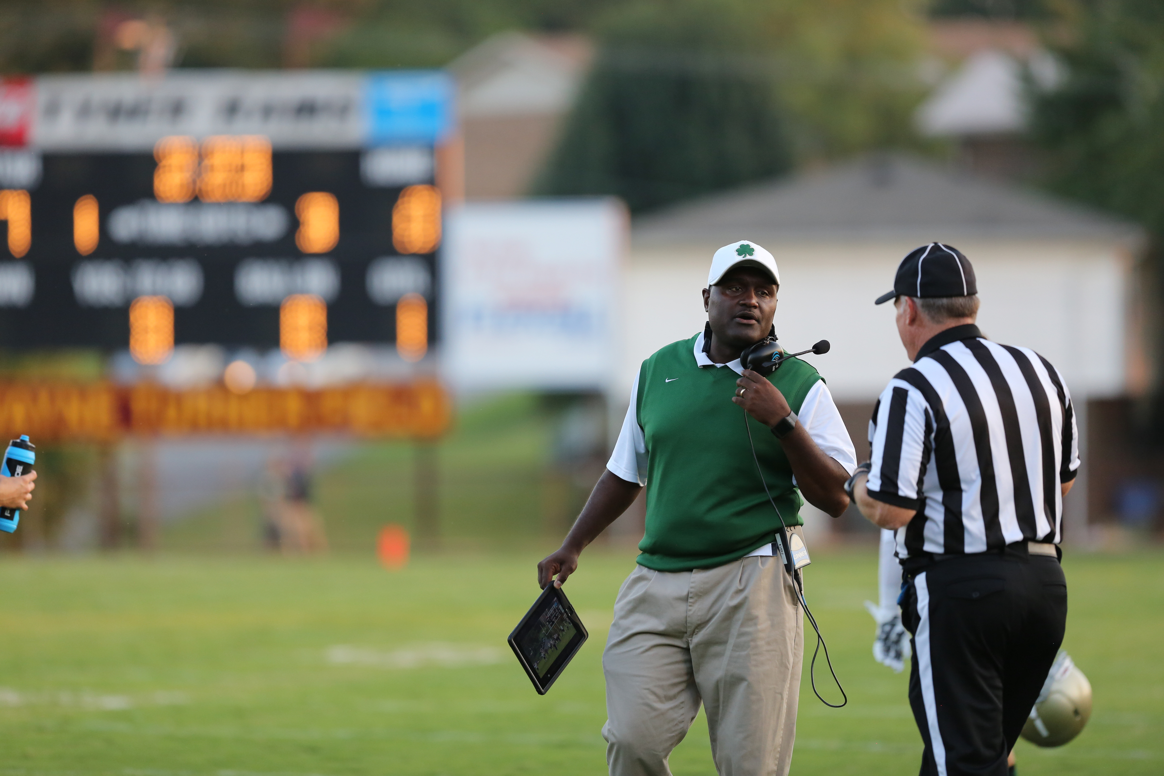 Notre Dame head coach Charles Fant consults a referee during the Notre Dame vs. Tyner prep football game at Tyner High School on Friday, Aug. 28, 2015 in Chattanooga, Tenn. (Staff photo by Maura Friedman)