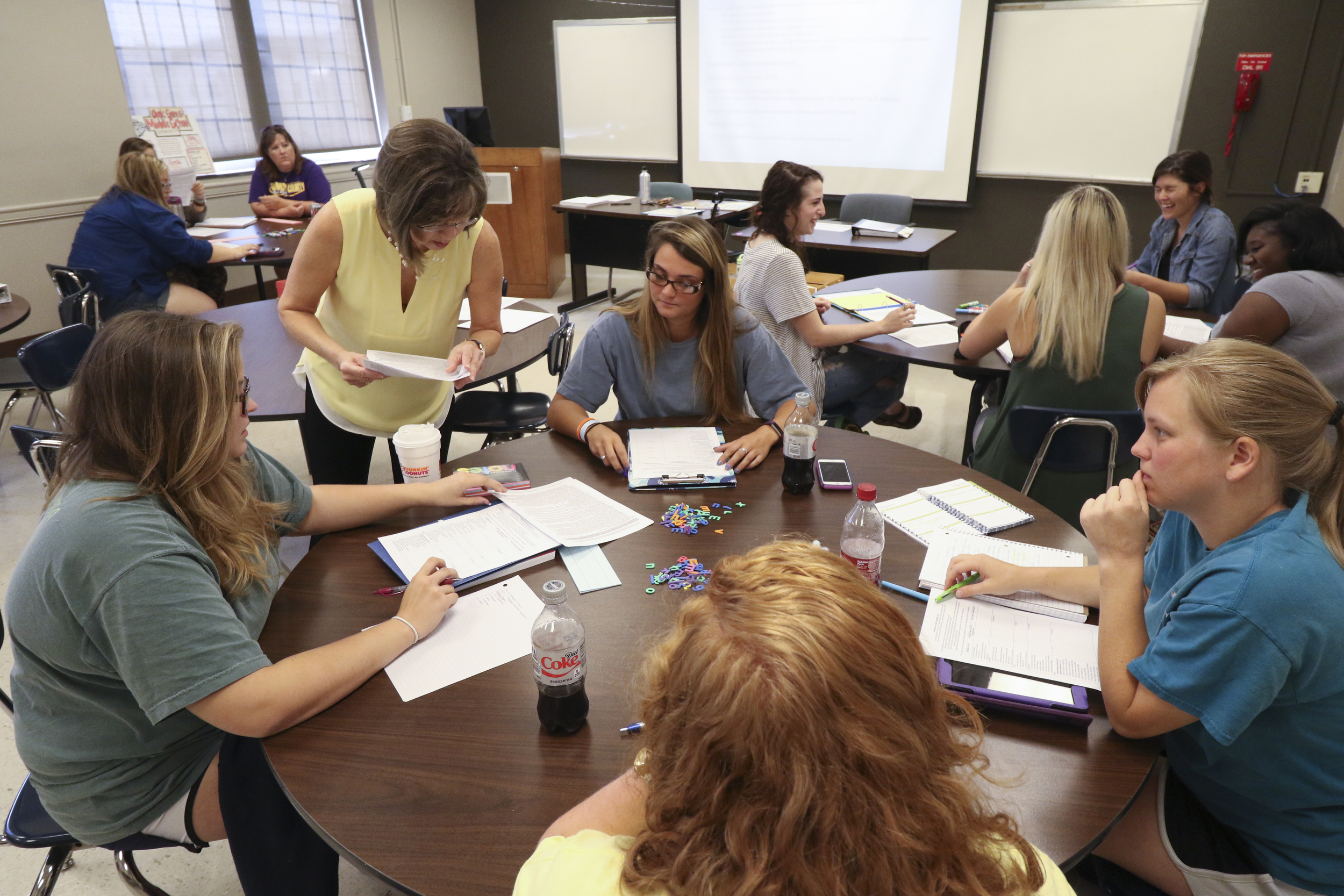 Staff Photo by Dan Henry / The Chattanooga Times Free Press- 7/21/16. Dr. Sarah Sandefur hands out quizzes after speaking with students about emergent literacy while at the University of Tennessee at Chattanooga on Thursday, July 21, 2016.