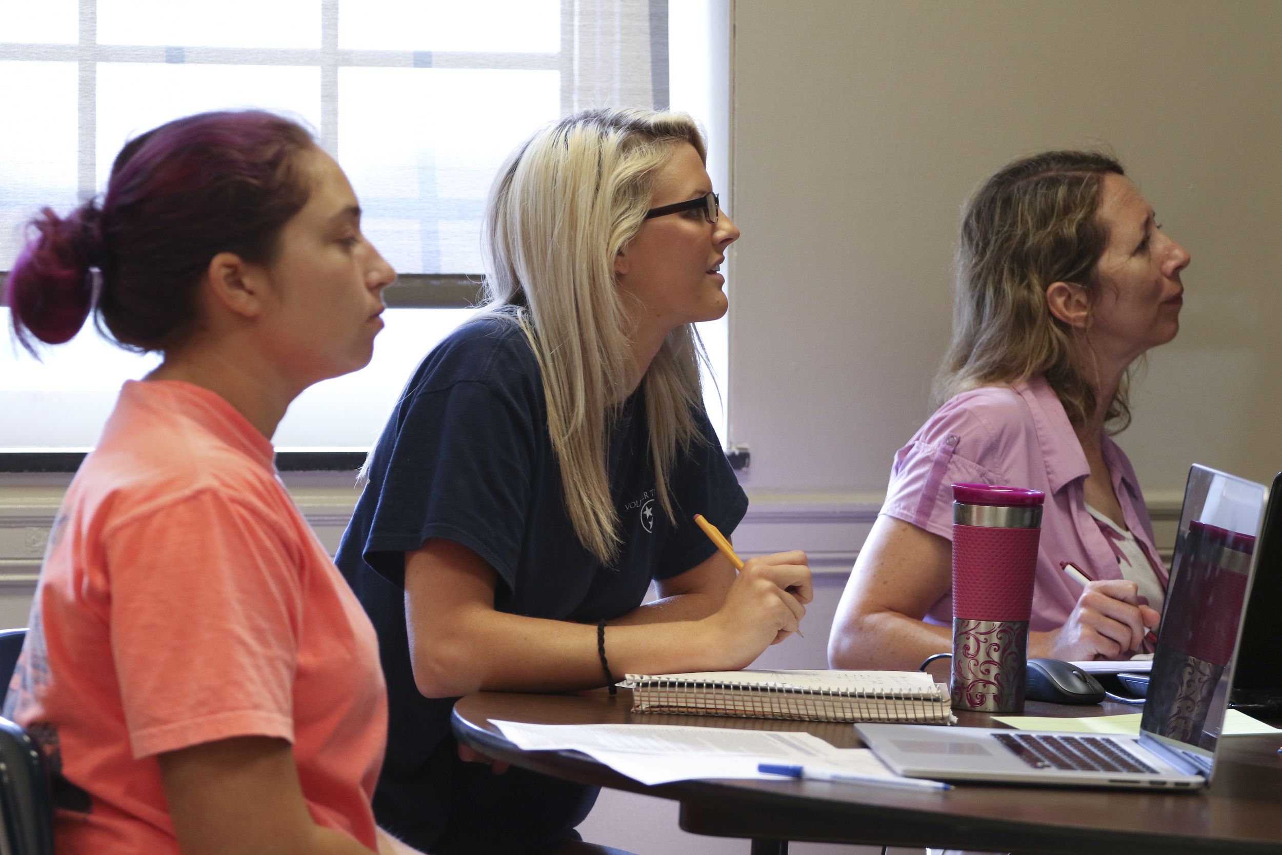 Staff Photo by Dan Henry / The Chattanooga Times Free Press- 7/21/16. Callie Horner, Kelsey McGhee and Angela Whitaker, from left, listen as Dr. Sarah Sandefur speaks about emergent literacy during her class at the University of Tennessee at Chattanooga on Thursday, July 21, 2016.