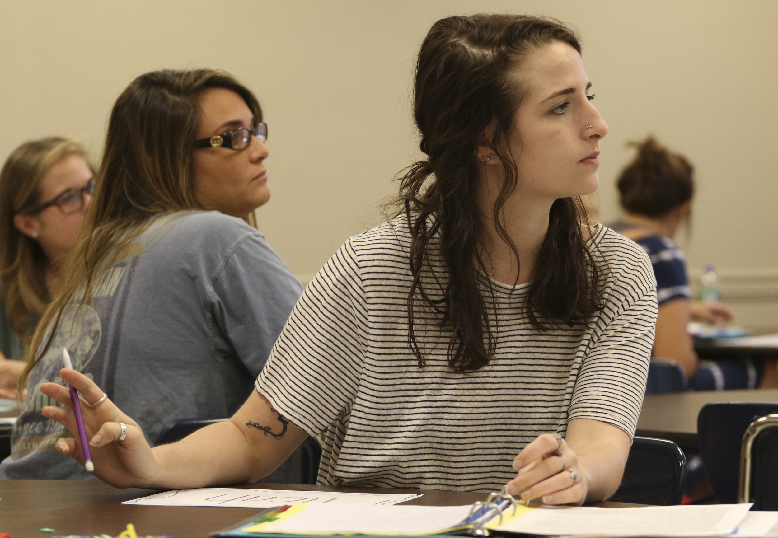 Staff Photo by Dan Henry / The Chattanooga Times Free Press- 7/21/16. Micah WIlkins, center, and other students listen as Dr. Sarah Sandefur speaks about emergent literacy while at the University of Tennessee at Chattanooga on Thursday, July 21, 2016.
