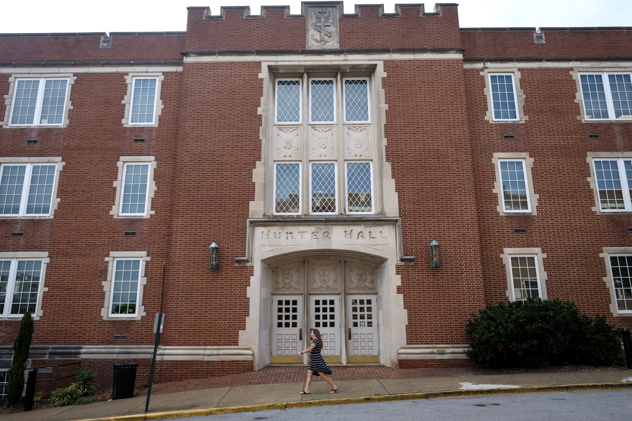 A woman walks past Hunter Hall, home of the UTC School of Education, on the school's campus Friday, July 22, 2016, in Chattanooga, Tenn.