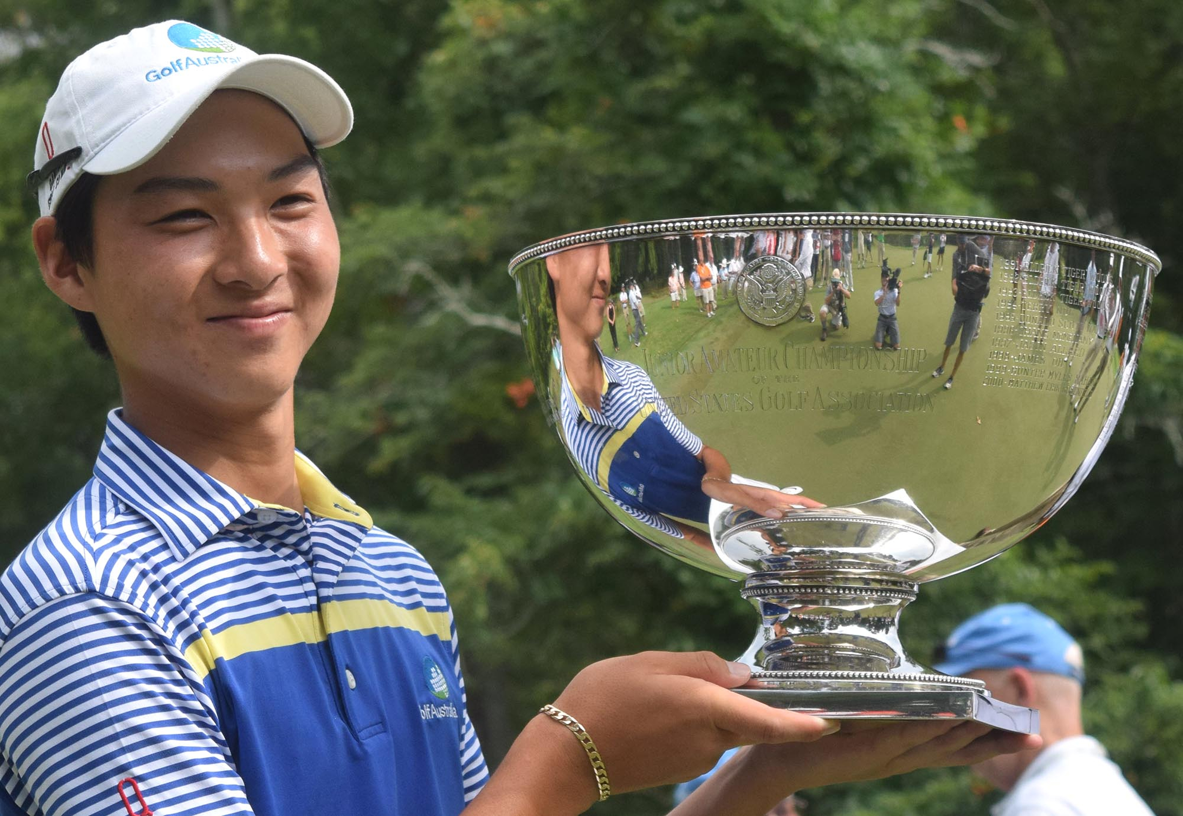 Australia's Min Woo Lee holds the championship trophy.  The final day of the 69th U.S. Junior Amateur Championship was held at the Honors Course in Ooltewah, Tennessee, Saturday July 23, 2016.