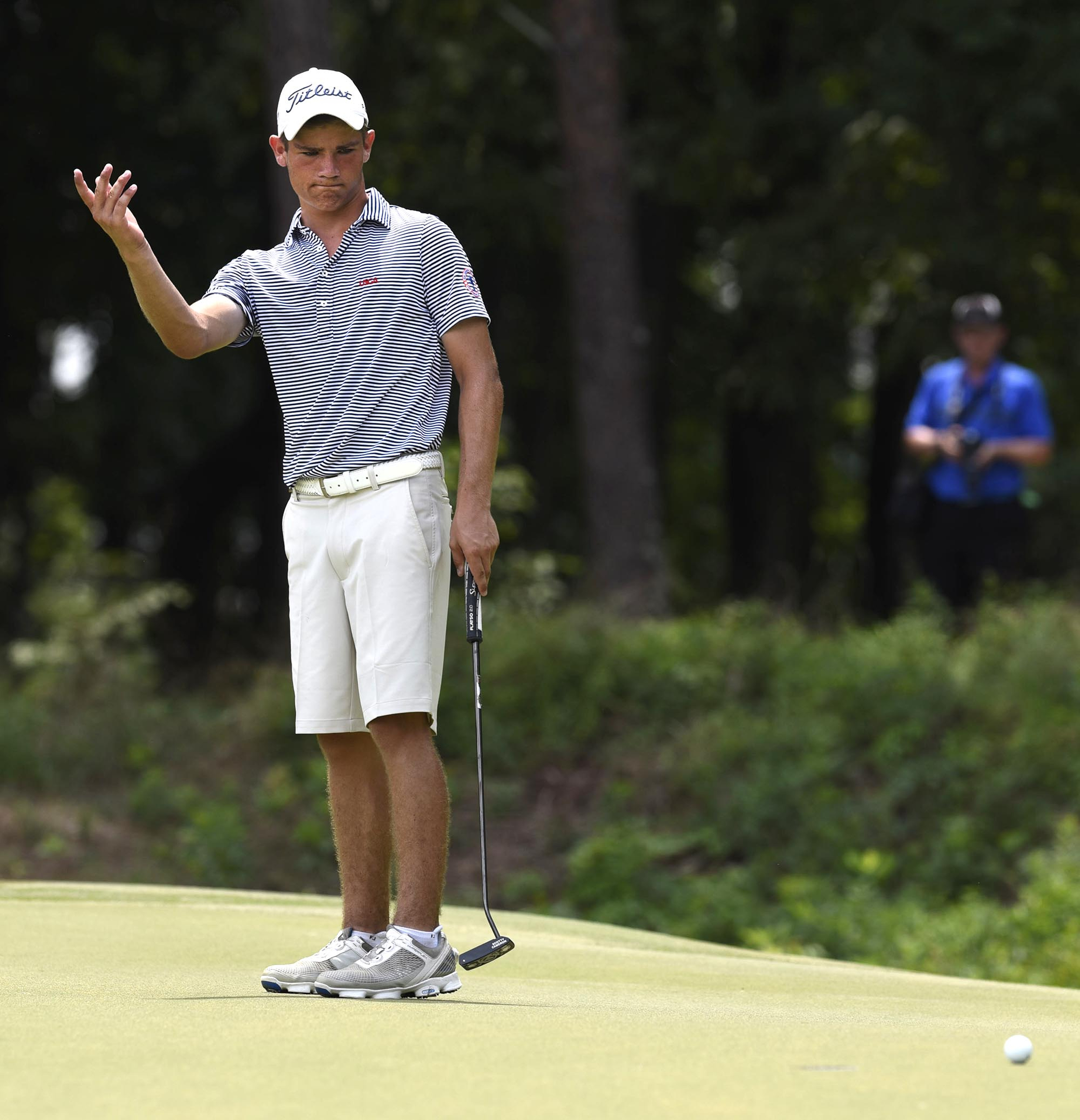 Noah Goodwin of Corinth, Texas reacts to missing a eagle putt on the 29th hole of the match.  The final day of the 69th U.S. Junior Amateur Championship was held at the Honors Course in Ooltewah, Tennessee, Saturday July 23, 2016.