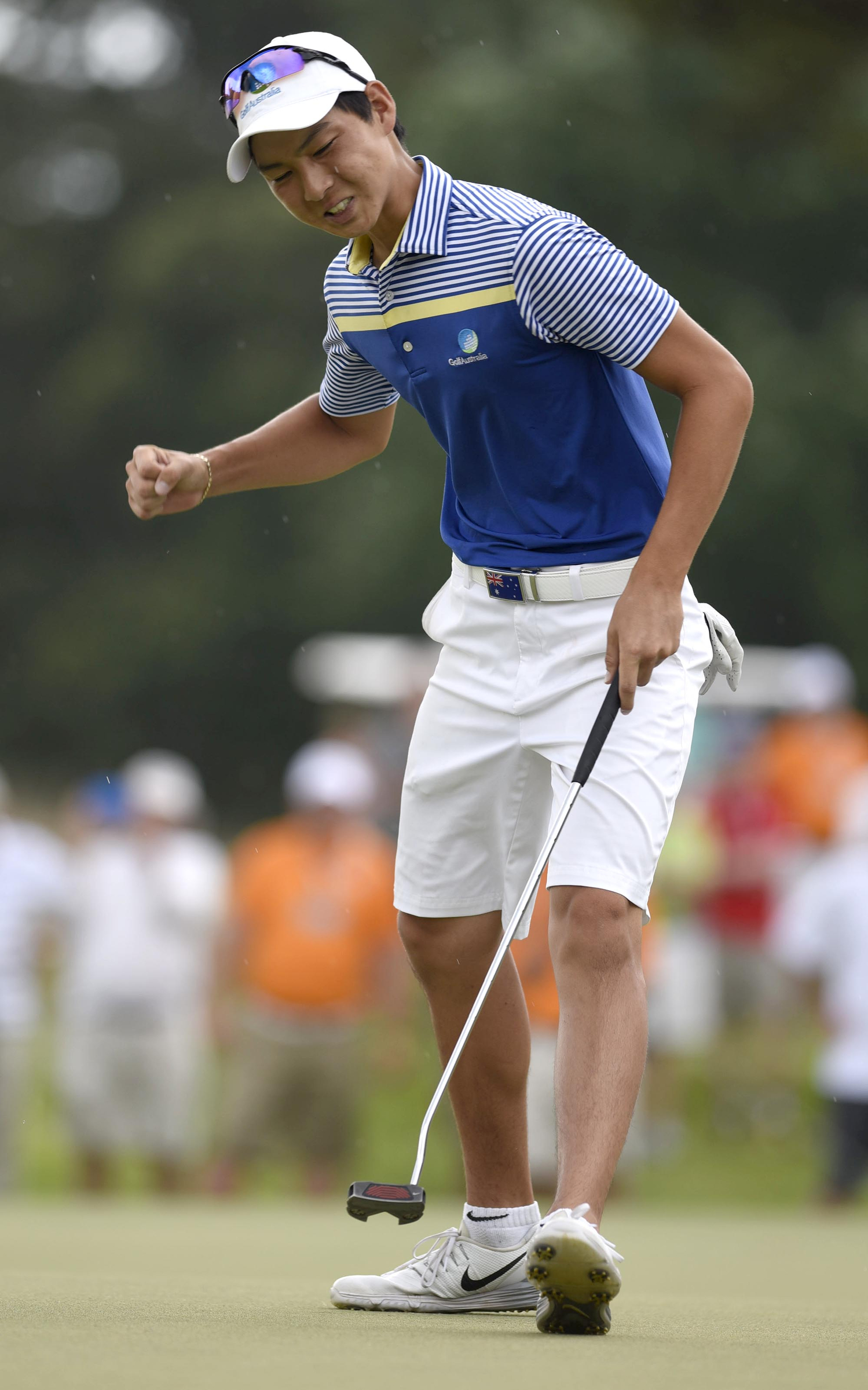 Australia's Min Woo Lee reacts as he sinks a putt on the 34th hole.  This putt gave him the lead for good.  The final day of the 69th U.S. Junior Amateur Championship was held at the Honors Course in Ooltewah, Tennessee, Saturday July 23, 2016.
