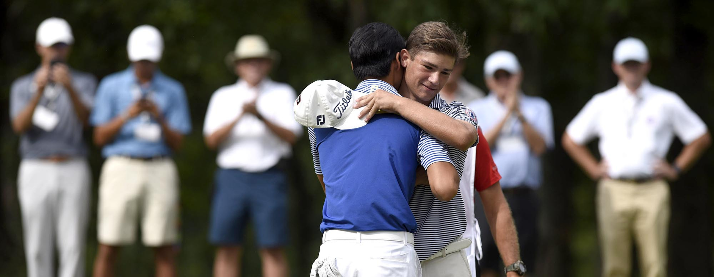 Australia's Min Woo Lee hugs Noah Goodwin after Lee won the championship.  The final day of the 69th U.S. Junior Amateur Championship was held at the Honors Course in Ooltewah, Tennessee, Saturday July 23, 2016.