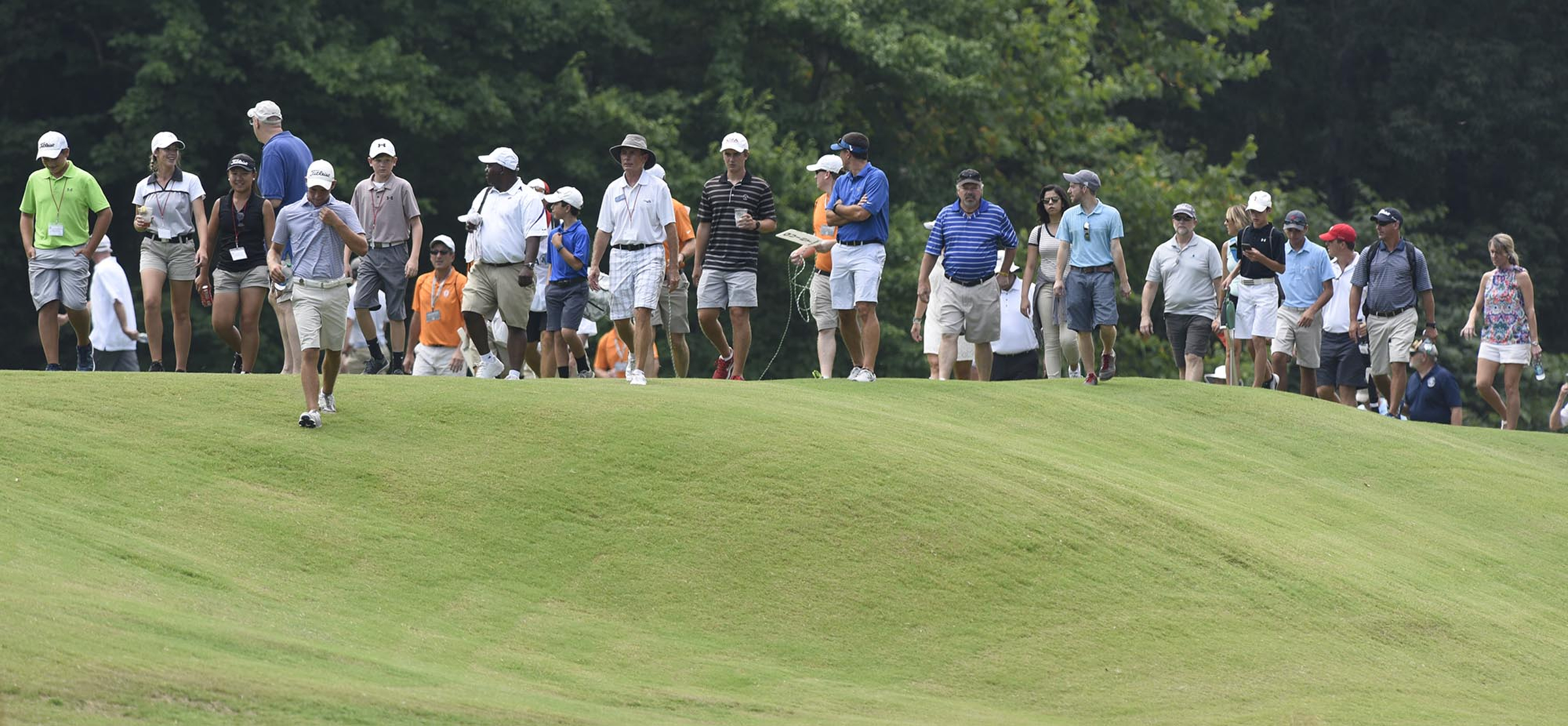 The gallery follows Noah Goodwin of Corinth, Texas down the fairway of the 19th hole of afternoon match.  The final day of the 69th U.S. Junior Amateur Championship was held at the Honors Course in Ooltewah, Tennessee, Saturday July 23, 2016.