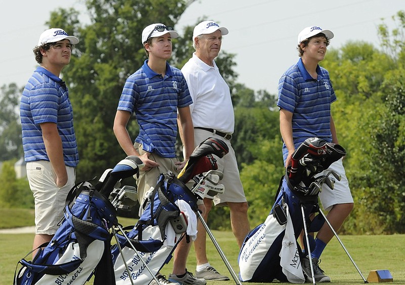 From left, Bowman Blocker, Riley Covington, coach Ed Connelly and Trent Cooper watch a tee shot Friday during Boyd-Buchanan's golf practice at Hickory Valley on Friday.