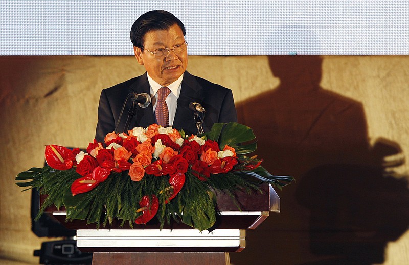 
              Laotian Prime Minister Thongloun Sisoulith gives a speech during the opening ceremony of the 49th Association of Southeast Asian Nations (ASEAN) Foreign Ministers' Meeting in Vientiane, Laos, Sunday, July 24, 2016. Southeast Asia's main grouping opened a meeting of their foreign ministers Sunday, deeply divided on how to deal with China's territorial expansion in the South China Sea that has impacted some of its members and whipped up an increasing diplomatic quagmire. (AP Photo/Sakchai Lalit)
            