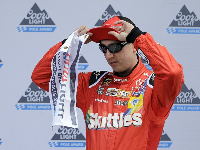 
              Sprint Cup Series driver Kyle Busch (18) adjust his hat after winning the pole for the Brickyard 400 NASCAR auto race at Indianapolis Motor Speedway in Indianapolis, Saturday, July 23, 2016. (AP Photo/Darron Cummings)
            