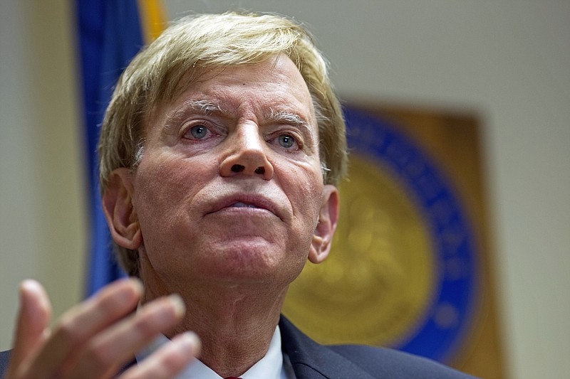 
              In this July 22, 2016, photo, former Ku Klux Klan leader David Duke talks to the media at the Louisiana Secretary of State's office in Baton Rouge, La. And far from hiding in chat rooms or under white sheets, they cheered the GOP presidential nominee inside the Republican National Convention over the last week. While not official delegates, they nevertheless obtained credentials to attend the party’s highest-profile quadrennial gathering. Donald Trump has publicly disavowed the white supremacist movement when pressed by journalists. Seizing on the energy, Duke on Friday announced a bid for the Senate.  (AP Photo/Max Becherer)
            