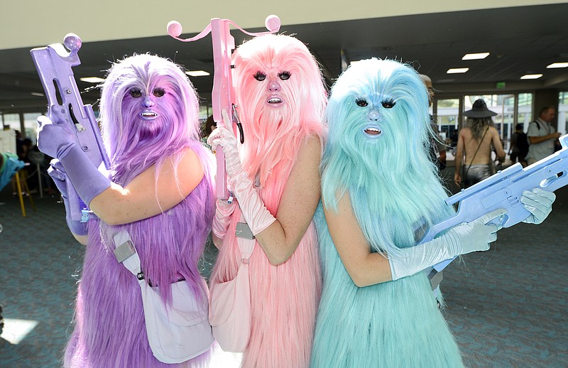 
              Fans dressed as "Chewie's Angels" pose for a photo on day two of Comic-Con International held at the San Diego Convention Center Friday, July 22, 2016, in San Diego.  (Photo by Denis Poroy/Invision/AP)
            