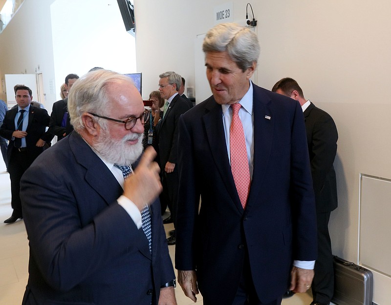 
              European Union Climate Commissioner Miguel Arias Canete welcomes U.S. Secretary of State John Kerry, from left, for talks to reduce hydrofluorocarbons under the Montreal Protocol at Vienna International Center in Vienna, Austria, Friday July 22, 2016. (AP Photo/Ronald Zak)
            