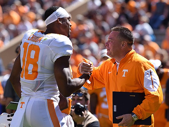 Tennessee's Jason Croom receives an award from coach Butch Jones at the Vols' spring game.