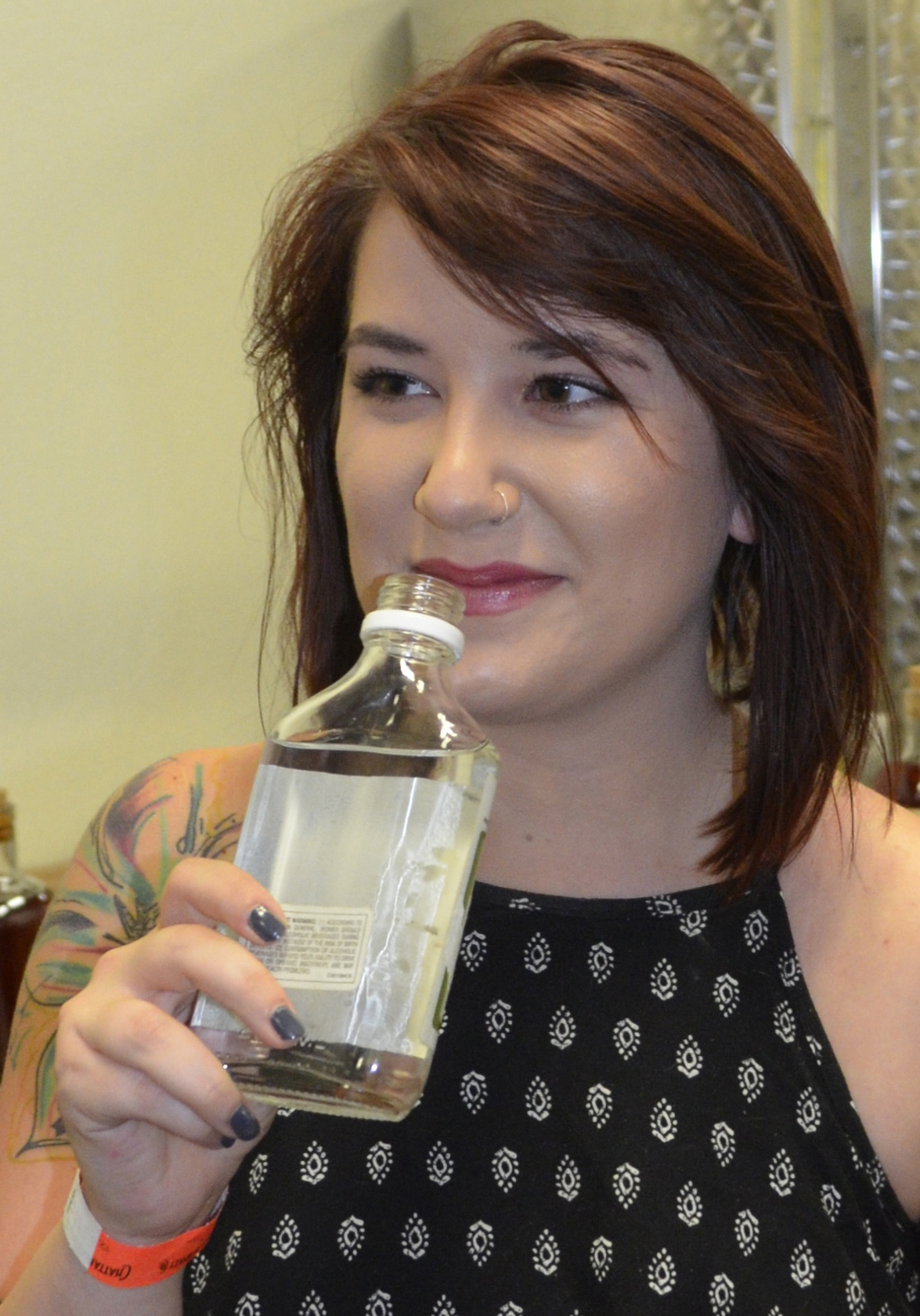 Chevalier smells the unaged, clear whiskey product.