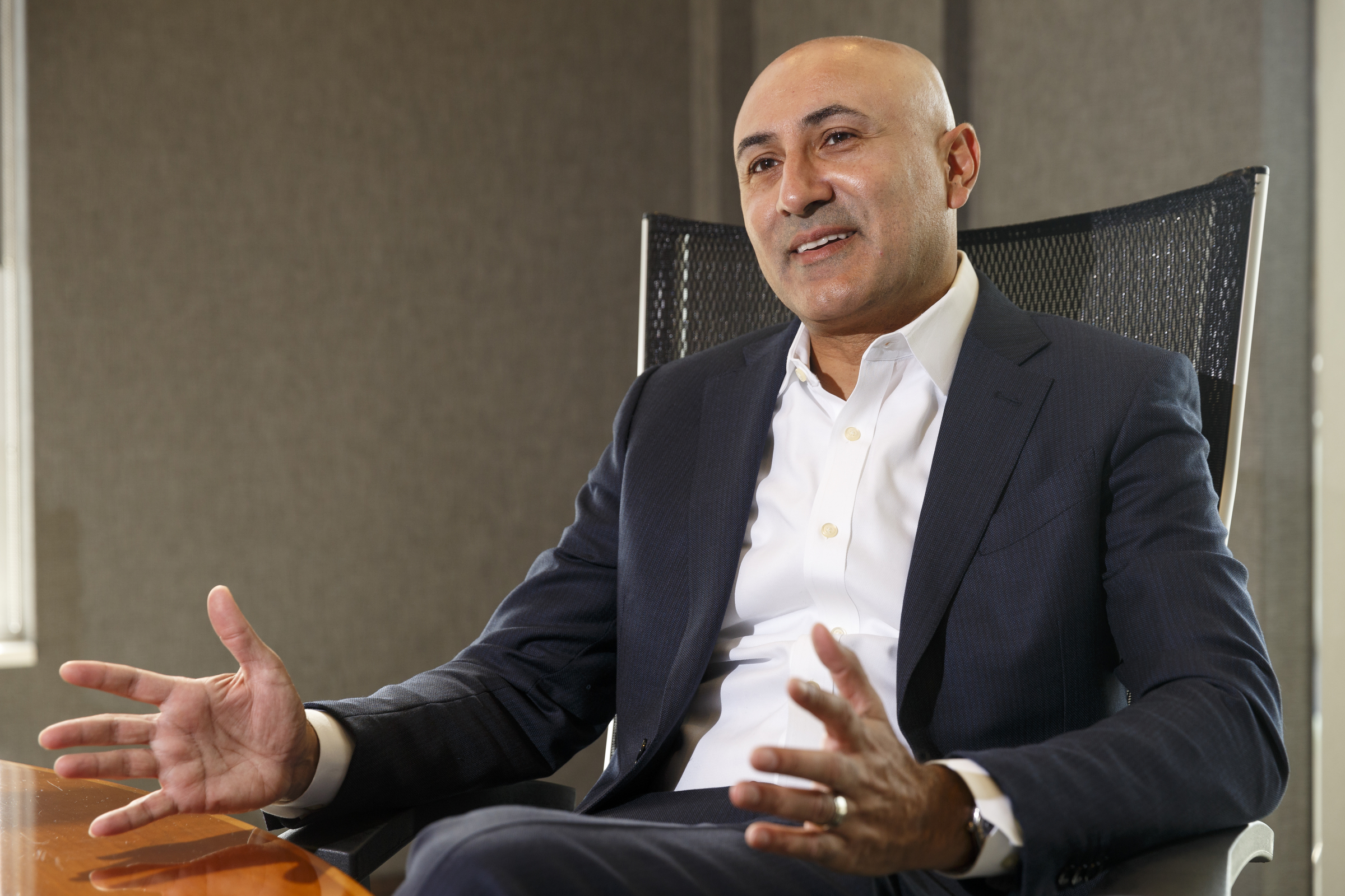 Vision Hospitality owner Mitch Patel talks at their offices.