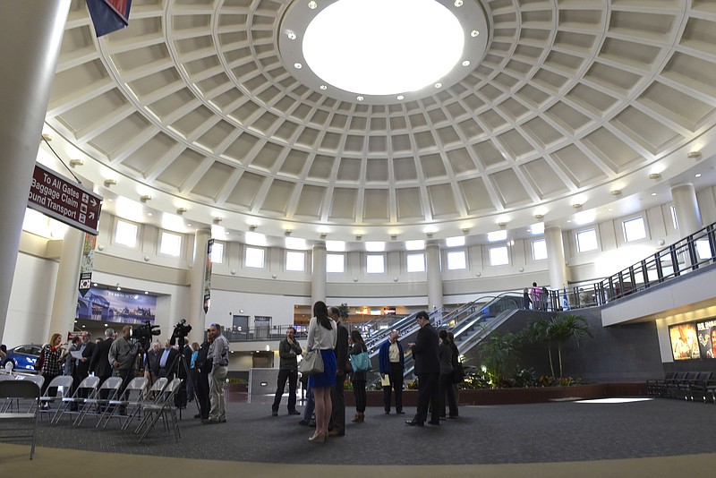 People wait for a press conference to unveil a high-definition live video stream from the Tennessee Aquarium in the lobby at the Chattanooga Metropolitan Airport on Mar. 29, 2016.