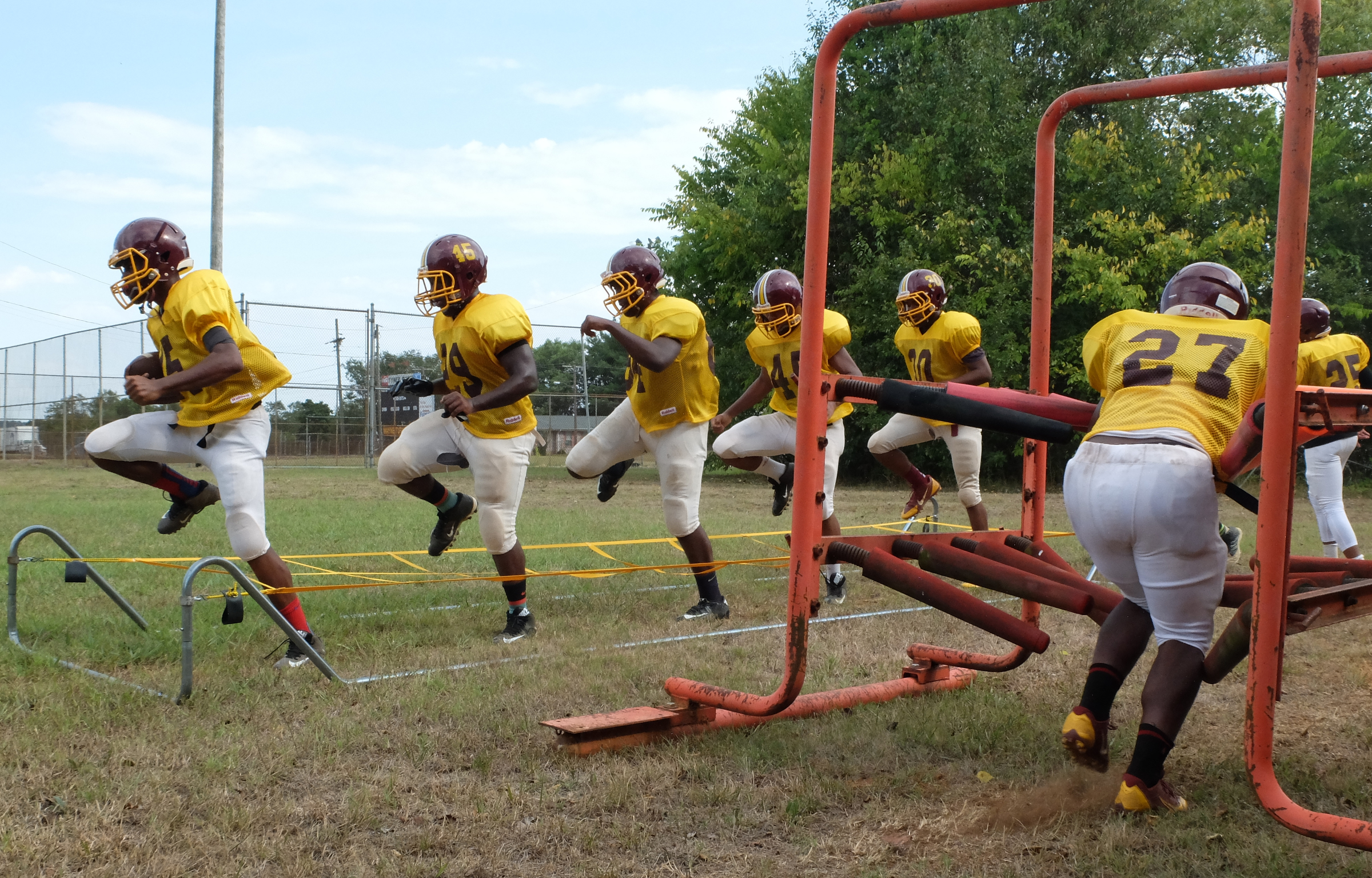 Tyner's running backs run their course early in practice on Monday at Wayne Turner Field.