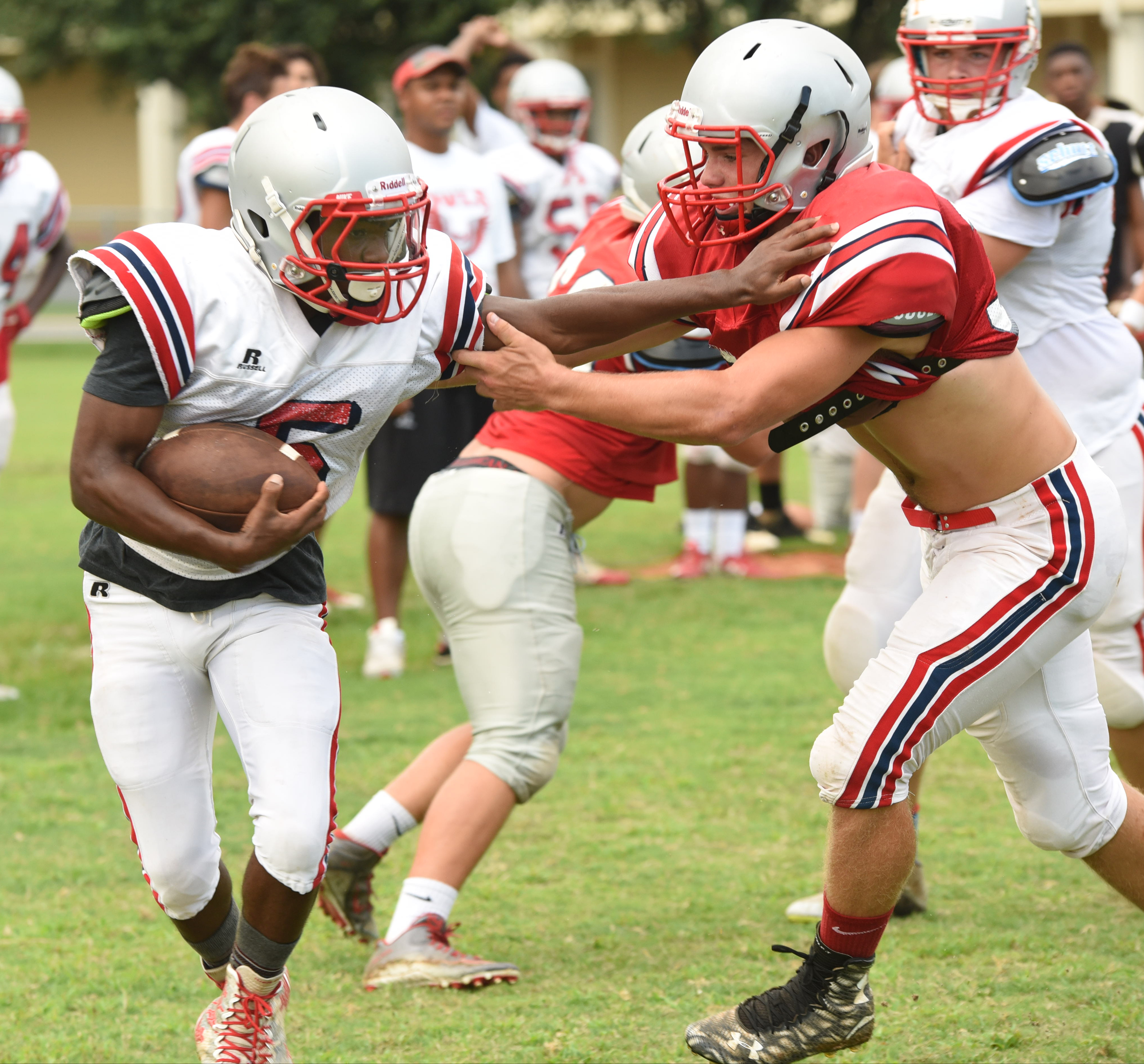 Ooltewah's Tylan Cargill (5) tries to fend-off the defensive pressure from Andy Reed during practice Monday.