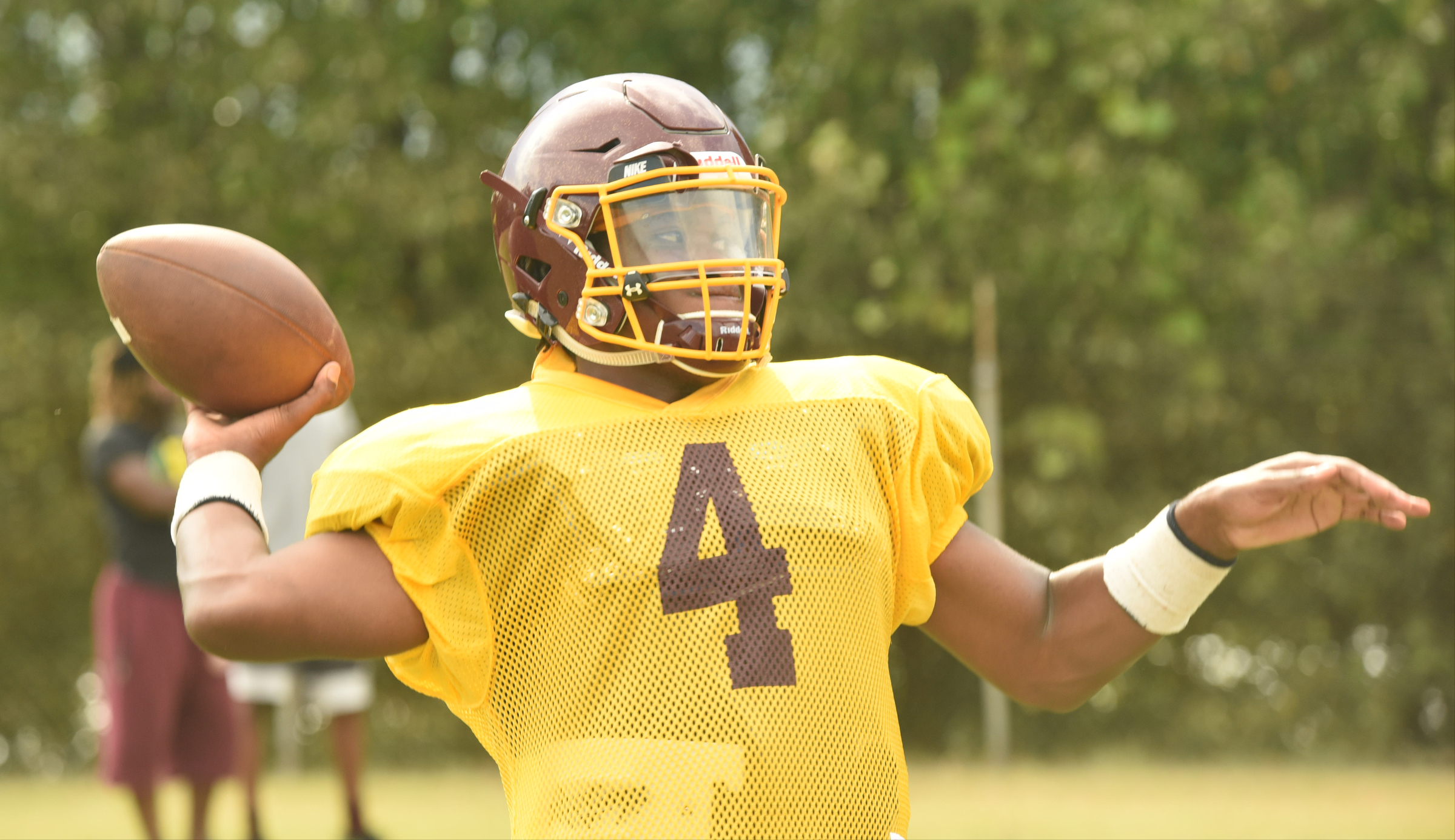 Tyner's Shaylan Bailey (4) warms up at the start of practice Monday at Wayne Turner Field.