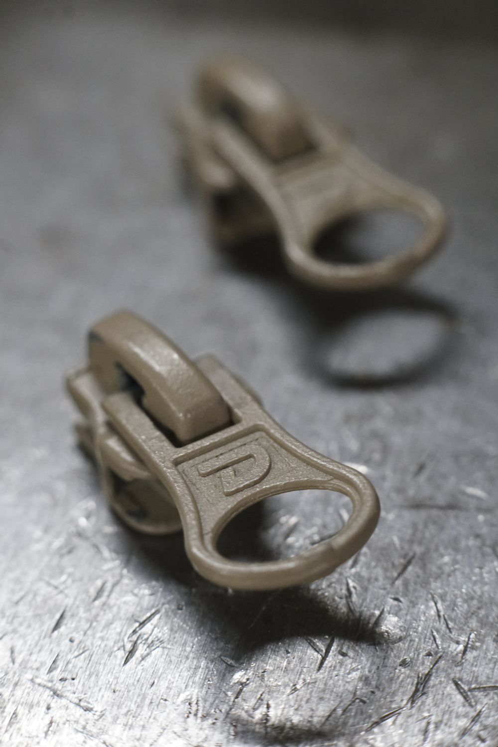 Staff Photo by Dan Henry / The Chattanooga Times Free Press- 7/25/16. Custom sliders for Dunlap Industries will be used on molded zippers as manufacturing continues Monday, July 25, 2016. DI makes molded and coil zippers for use with U.S. Army and other high use applications.