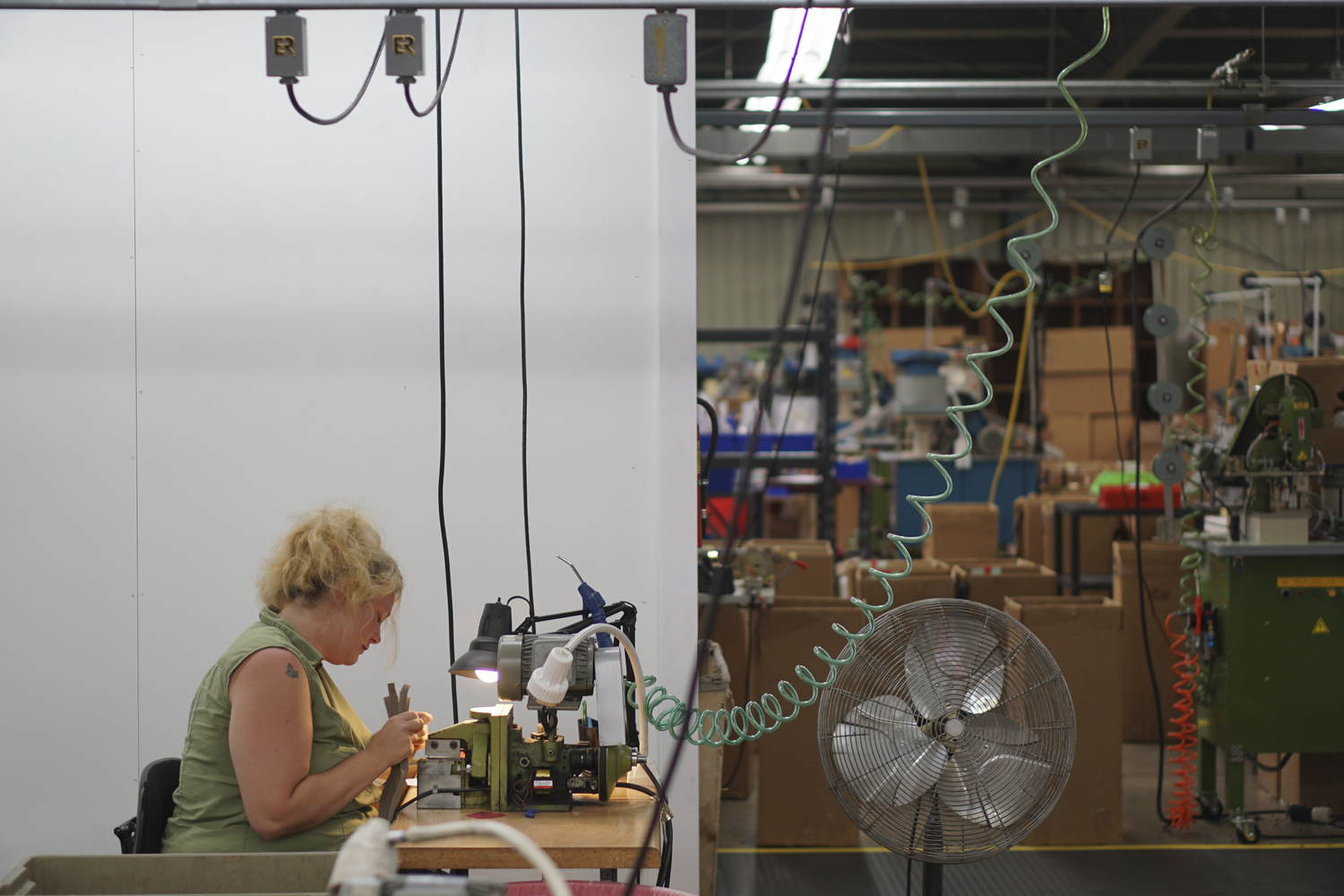 Staff Photo by Dan Henry / The Chattanooga Times Free Press- 7/25/16. Beth WIlson cuts zippers while at Dunlap Industries on Monday, July 25, 2016. DI makes molded and coil zippers for use with U.S. Army and other high use applications.