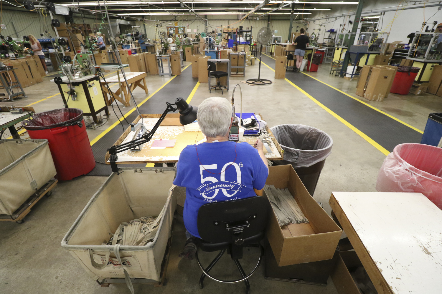 Staff Photo by Dan Henry / The Chattanooga Times Free Press- 7/25/16. JoAnn Southerland, a 30-year employee with Dunlap Industries, pinks coil zippers on Monday, July 25, 2016. DI makes molded and coil zippers for use with U.S. Army and other high use applications.