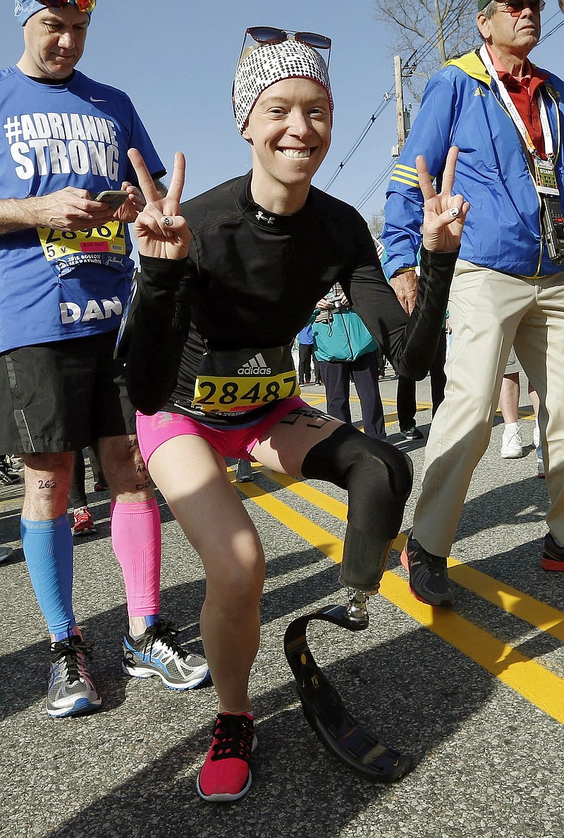 
              FILE - In this April 18, 2016, file photo, Boston Marathon bombing survivor Adrianne Haslet poses at the starting line in Hopkinton, Mass., before running in the 120th Boston Marathon. On Sunday, July 24, 2016, Davis reached the summit of Volcan Cayambe, Ecuador's third-highest mountain, with a team of climbers from the Range of Motion Project. The nonprofit group helps provide prosthetic limbs to people around the world who don't have access to them. (AP Photo/Michael Dwyer, File)
            