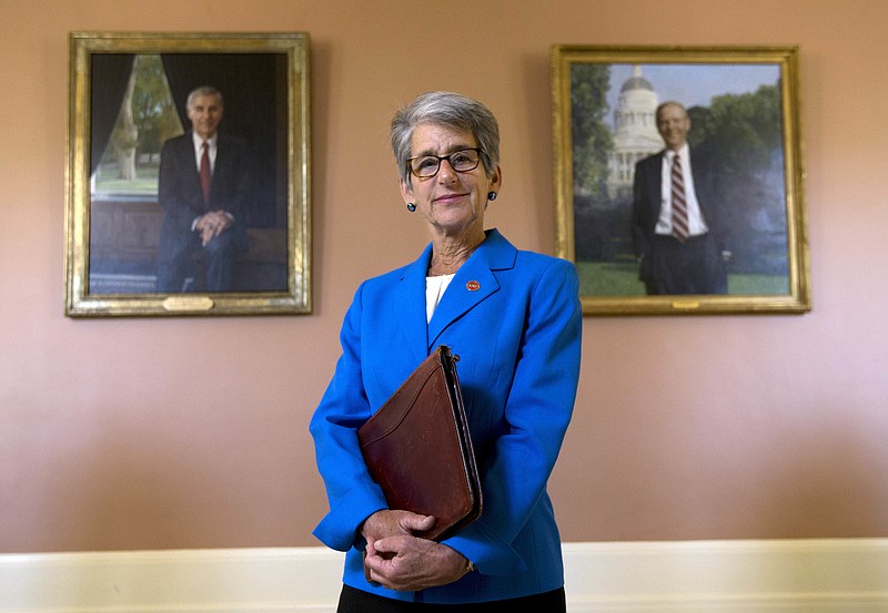 
              California state Sen. Hannah-Beth Jackson, D-Santa Barbara, poses in front of portraits of two former California governors, Republicans George Deukmejian, left and Pete Wilson, at the Capitol in Sacramento, Calif., on Wednesday, June 29, 2016. Jackson had long been active in her community beyond her work as a lawyer and former prosecutor, but it took the encouragement of one of her mentors to convince her to run for state Assembly in 1998. “Women tend to ask permission, and we’re never quite sure we are good enough or ready enough,” she said. “Men generally don’t have those same concerns.” (AP Photo/Rich Pedroncelli)
            