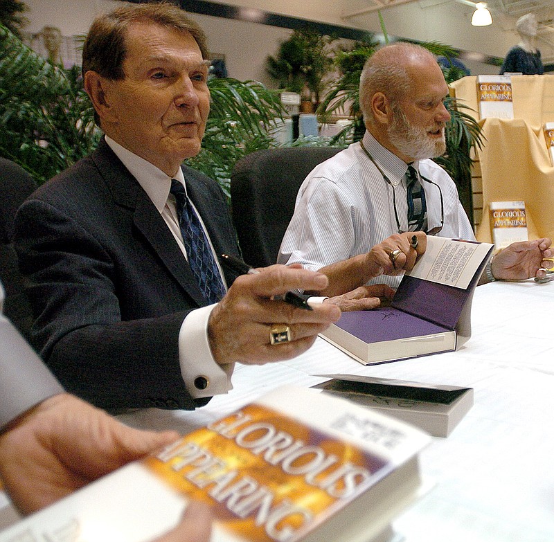 
              FILE - In an April 4, 2004 file photo, co-authors Tim Lahaye, left, and Jerry B. Jenkins sign copies of their newest book Glorious Appearing in Bossier City, La. LaHaye, the author of the multimillion best-selling ``Left Behind’’ novels about the return of Jesus and the rapture, died Monday, July 25, 2016, in San Diego days after suffering a stroke, according to his publicist. He was 90 years old. (Shane Bevel/The ( Shreveport ) Times via AP, File)
            