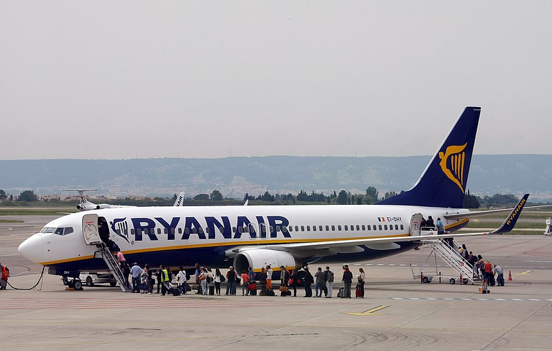 
              FILE- In this Wednesday, May 13, 2015 file photo passengers disembark a Ryanair plane, at the Marseille Provence airport, in Marignane, southern France. Ryanair said Monday, July 25, 2016 it will reduce winter services at its main London hub and focus on other European bases because of weakened British growth and consumer sentiment following Britain’s vote to leave the EU. (AP Photo/Claude Paris, File)
            