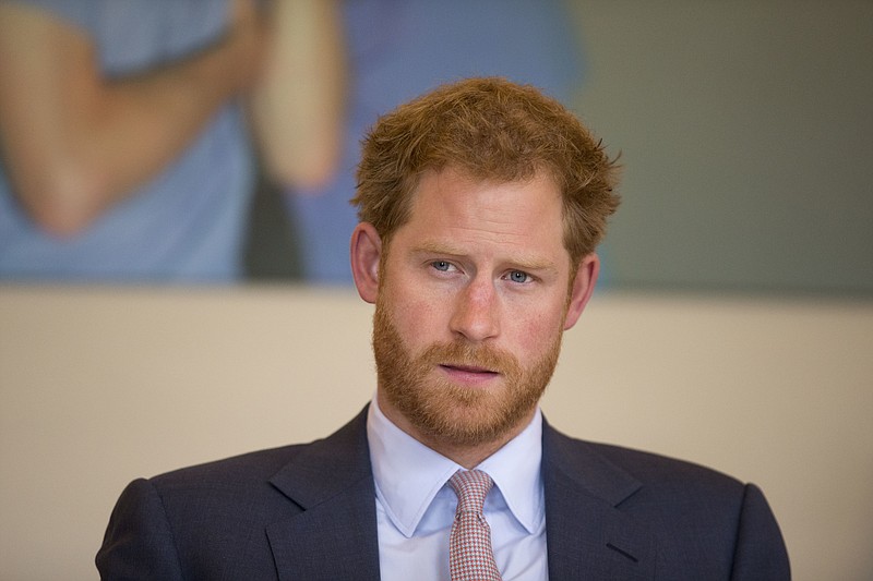 
              CORRECTS DATE THAT PRINCE HARRY'S MADE HIS COMMENTS ABOUT HIS MOTHER'S DEATH FILE - This is a Thursday, July 7, 2016 file photo of Britain's Prince Harry as he takes part in a round table discussion with HIV doctors at King's College Hospital in south London as part of his desire to learn more and raise public awareness in the fight against HIV and AIDS both internationally and in the UK.  Britain's Prince Harry said in mid July 2016  that he wishes he had spoken sooner about the death of his mother, Princess Diana. Harry, who did not speak about his bereavement until three years ago, told the BBC that it wasn't a sign of weakness to speak about problems.   (AP Photo/Matt Dunham, Pool, File)
            