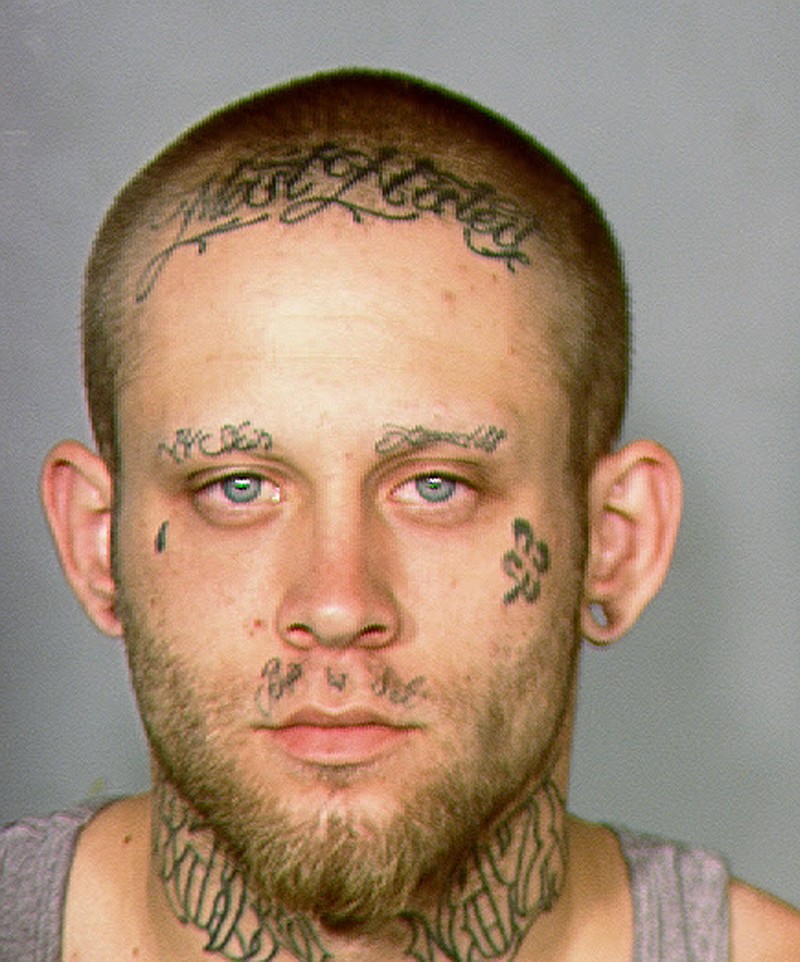 
              This 2013 law enforcement booking photo provided by the Las Vegas Metropolitan Police Department shows Bayzle Morgan. A Las Vegas judge has ordered a cosmetologist to cover Morgan's neck and facial tattoos that include a swastika and the words "Most Wanted" on each day of his robbery trial, in an effort to get him a fair trial. Judge Richard Scott Monday, July 25, 2016, ordered the concealment after an entire jury pool said they couldn't be impartial after seeing the tattoos. A new group will see him in the makeup Monday. (Las Vegas Metropolitan Police Department via AP)
            