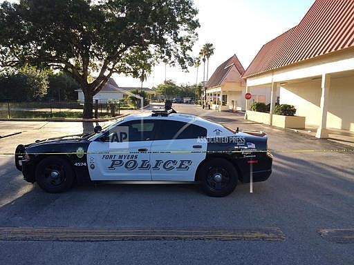 A police vehicle blocks off the area near Club Blu after a fatal shooting in Fort Myers, Fla., Monday, July 25, 2016. (AP Photo/Joshua Replogle)