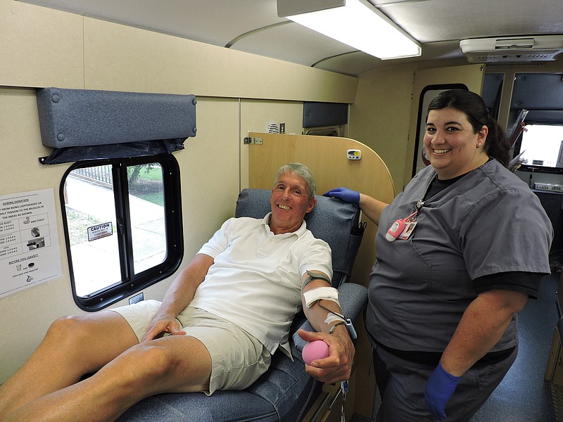 Retired U.S. Marshal Bob Church, of Ringgold, donates blood at the Dr. Steve's Place Community Blood Drive in downtown Ringgold July 15.