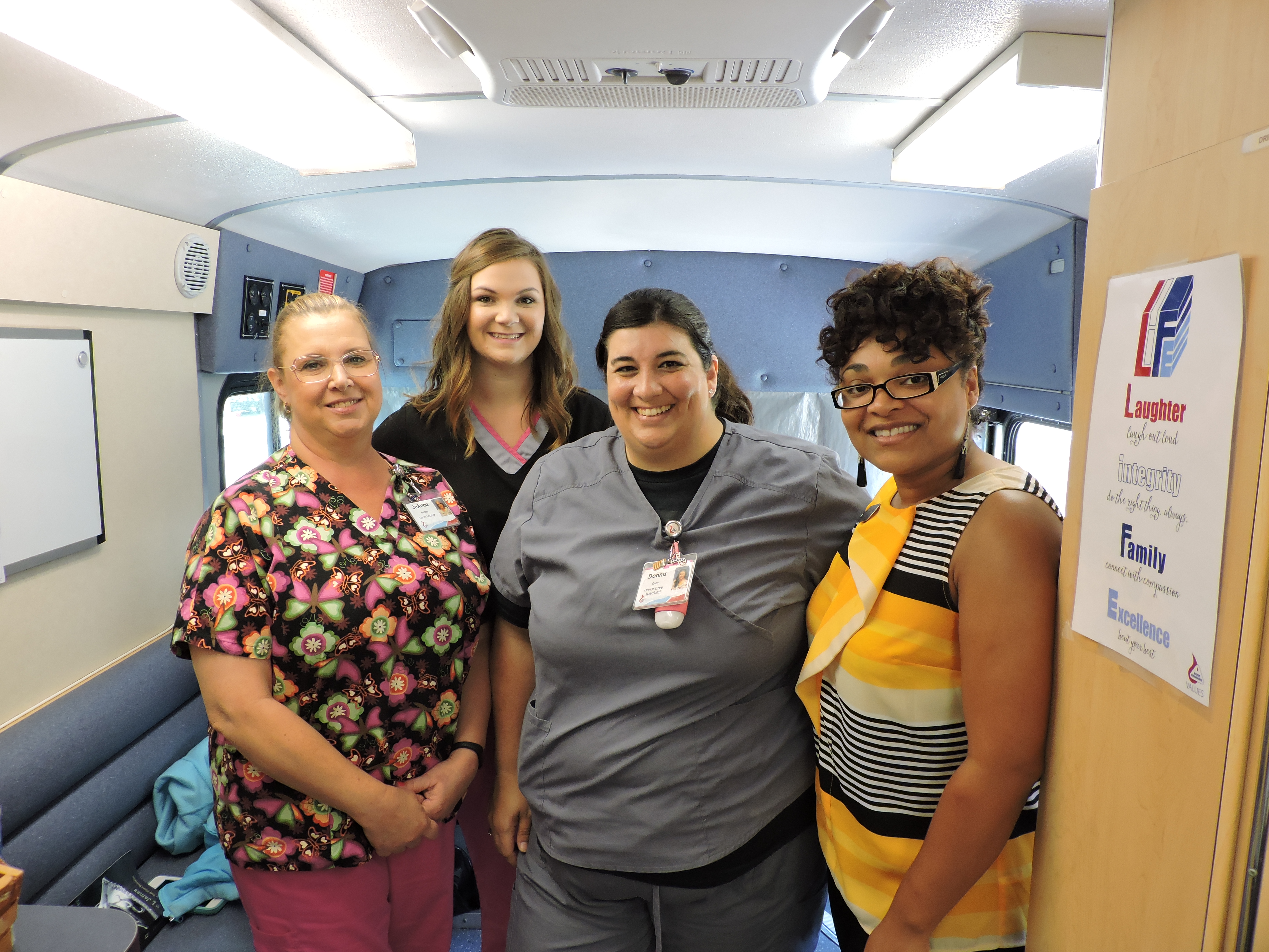 Blood Assurance Team Leader JoAnna Perbes, Donor Care Specialist Justice Barber, Donor Care Specialist Donna Gray and Donor Recruiter Nikita Edwards, from left, welcome people to the Blood Assurance Blood Vessel bus during the Dr. Steve's Place Community Blood Drive in Ringgold.